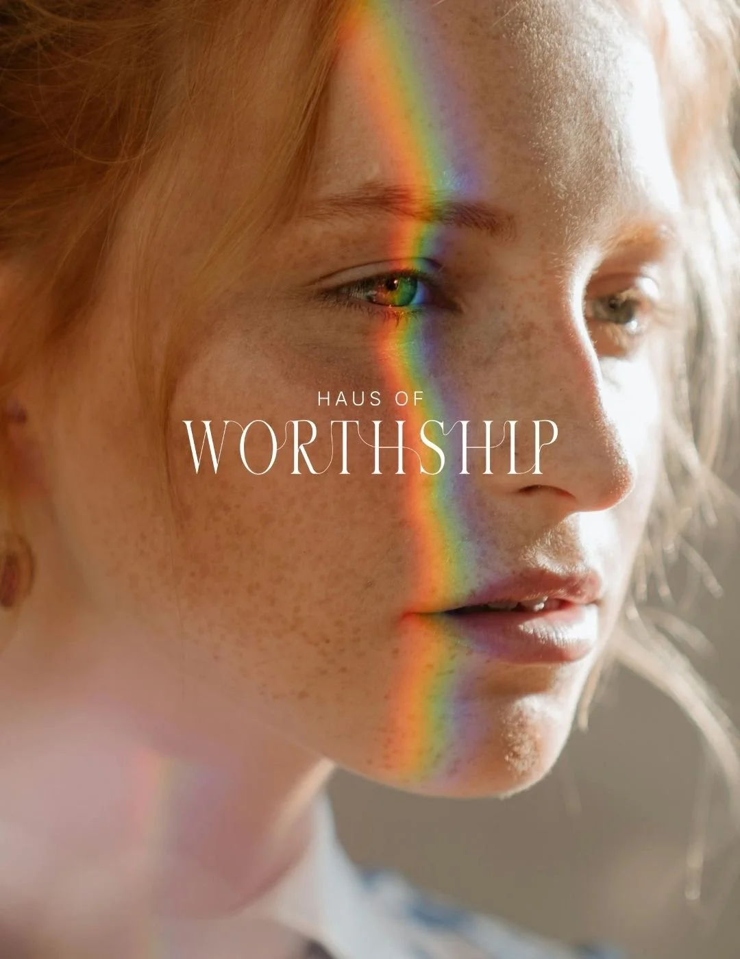 Close-up of a woman's face with sunlight casting a rainbow reflection across her face and eye, with the text 'Haus of Worthship' overlayed