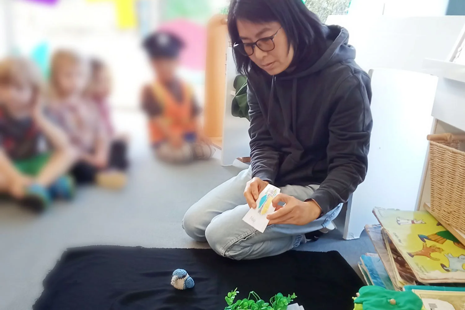 Language development at Uplands Kindergarten, Remuera daycare with experienced teacher encouraging conversations and social skills