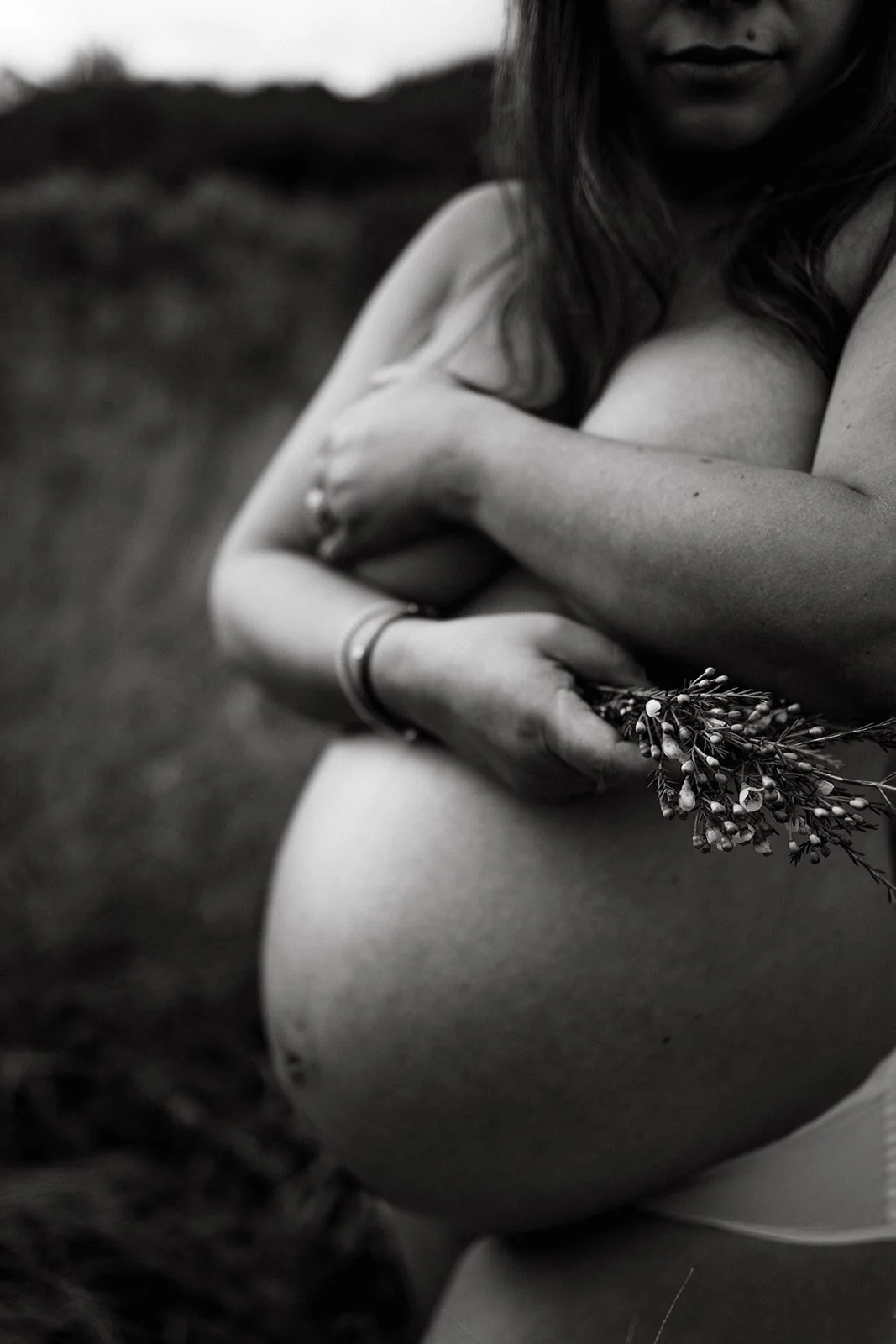 Field maternity photograph with a beautiful natural feel.