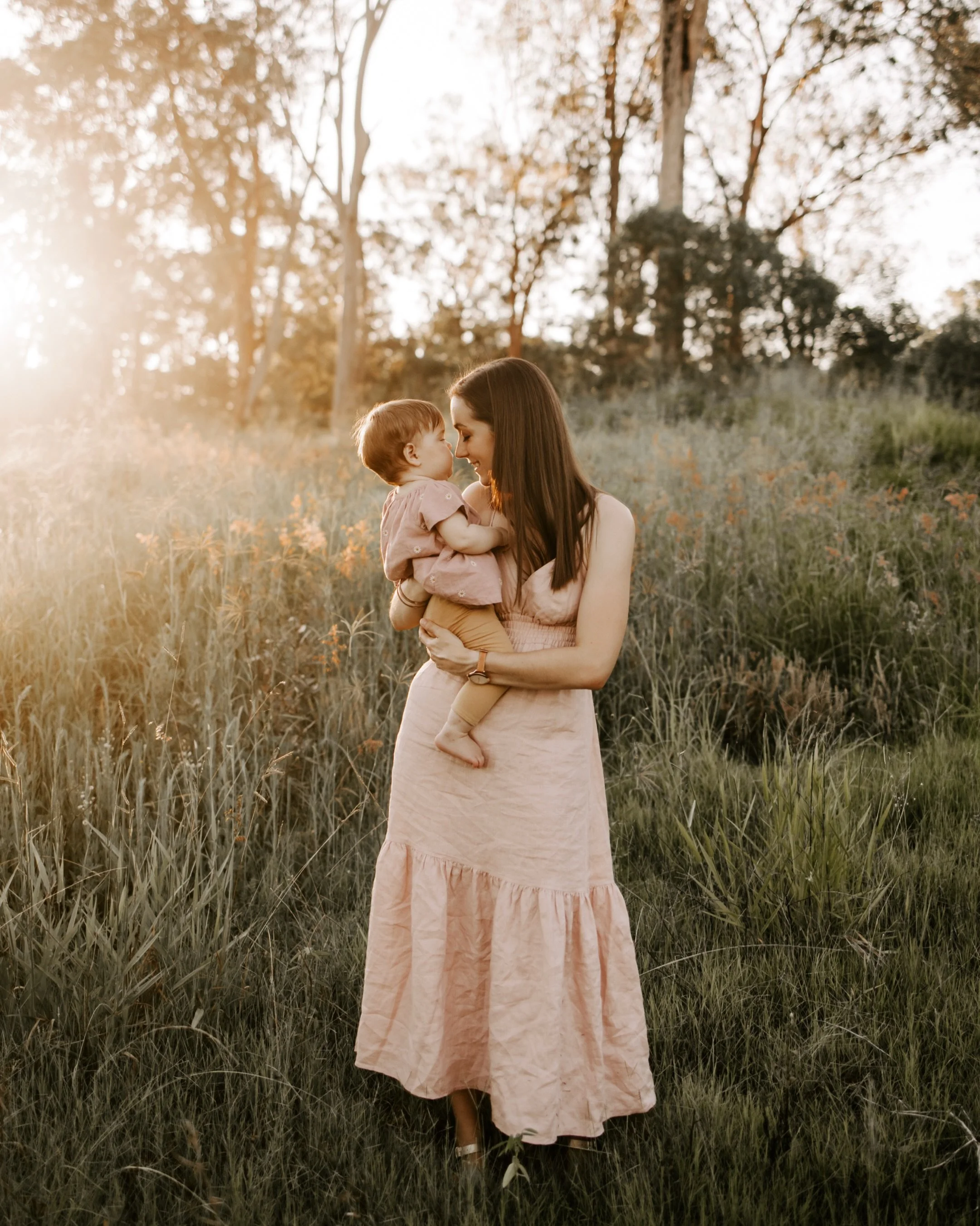 🌾 All of the families I photograph and the places we explore stay in my heart forever. This session years ago but still fresh in my mind as I was hunting an image for my website&mdash; a simple stroll through the tall gums of their backyard, a purpl
