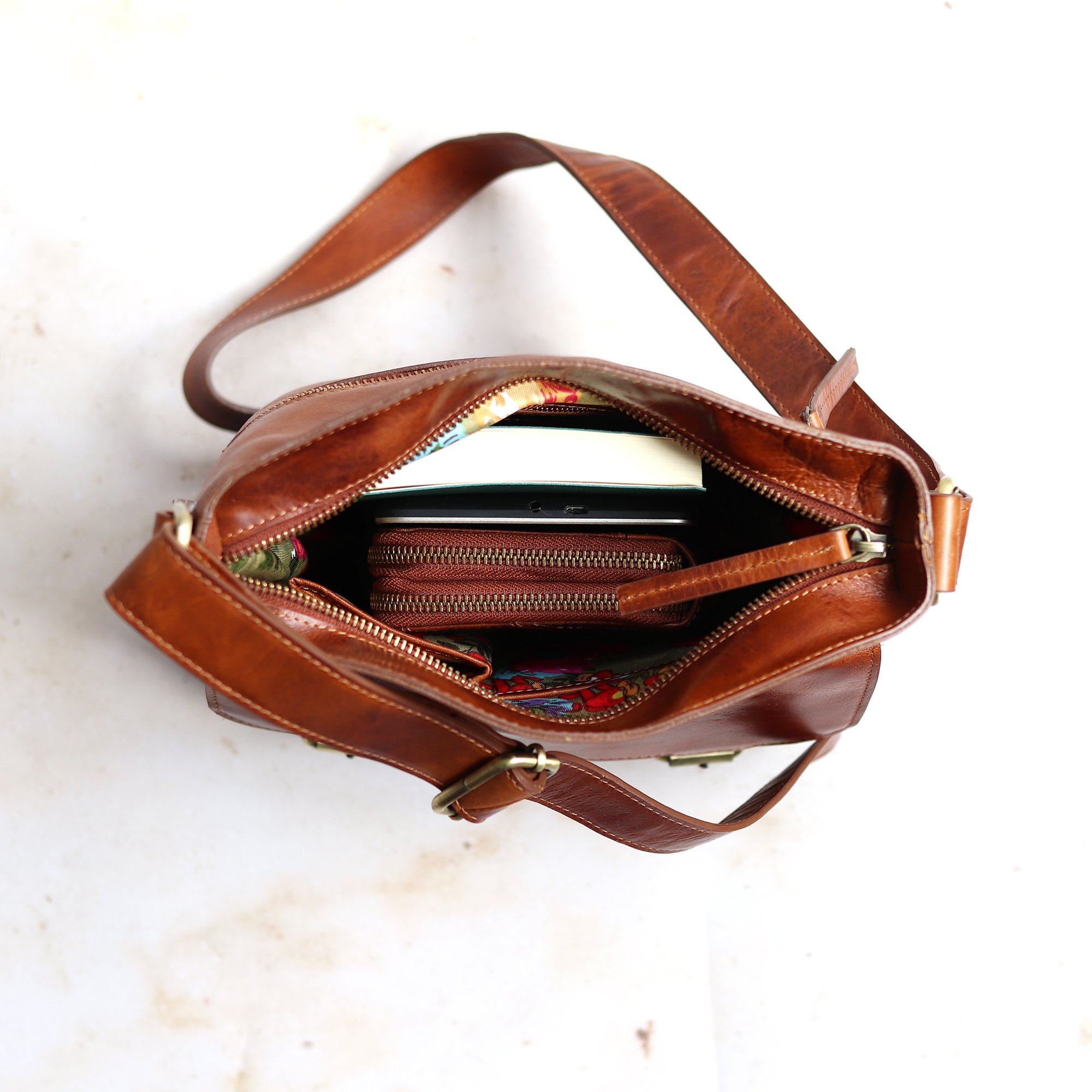 Ashley tan leather crossbody bag with interior shown