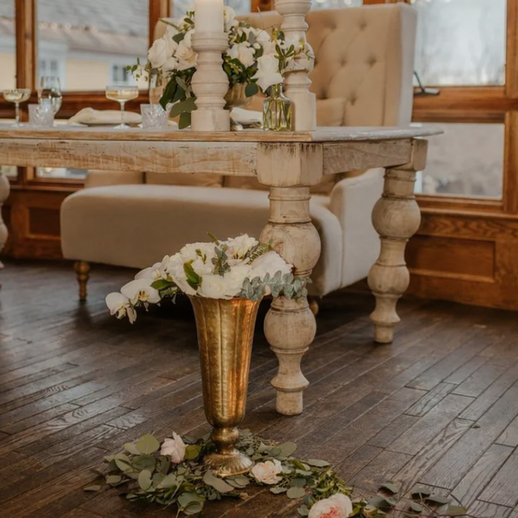 Elegant indoor setting with floral arrangement.png