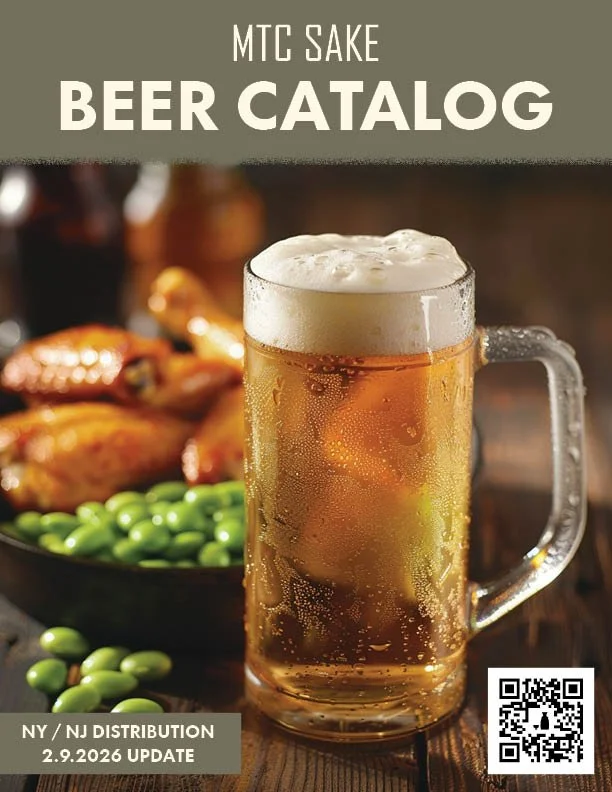 Beer in a mug with foam on top, accompanied by a plate of chicken wings and green edamame beans in the background, part of a beer catalog cover.