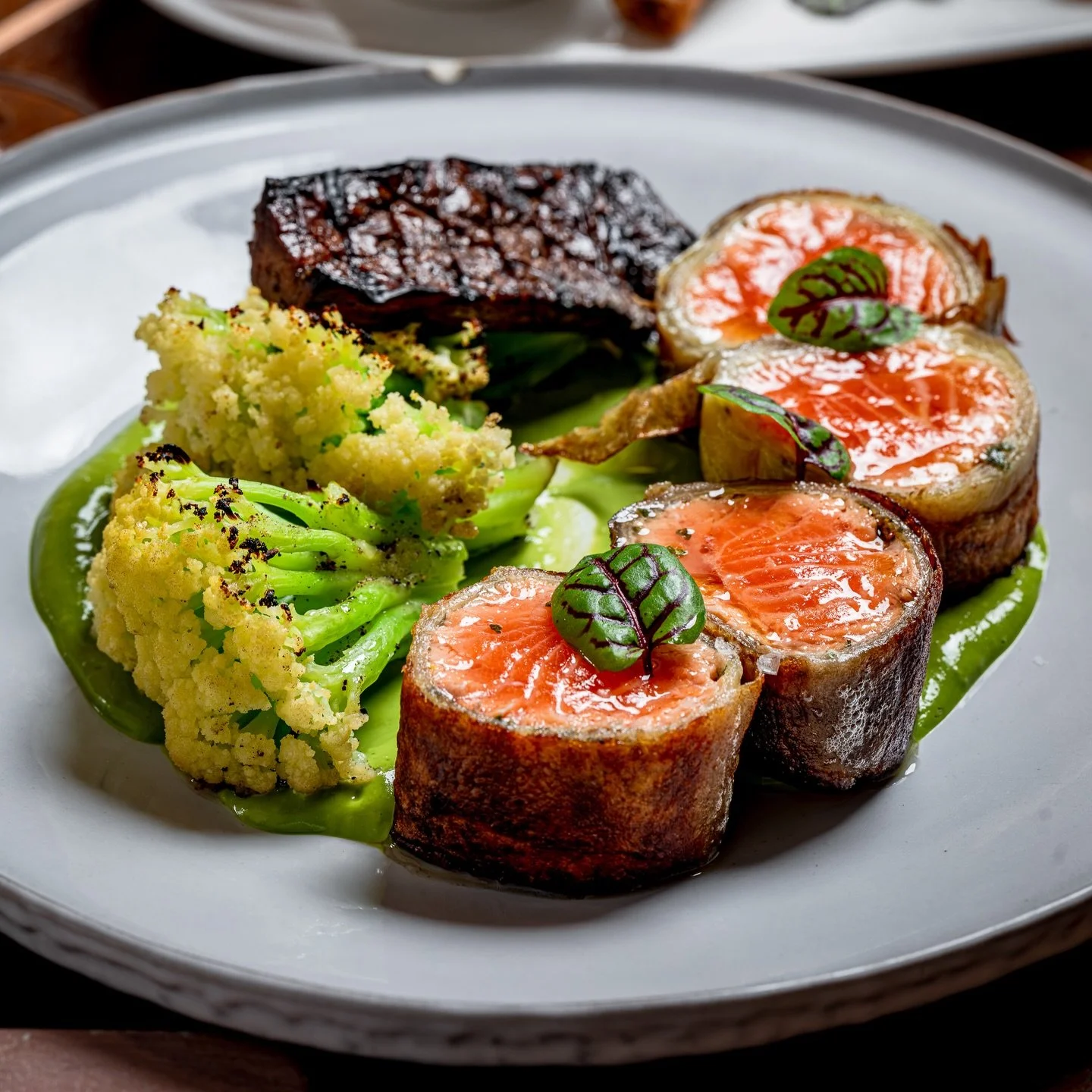 Faroe Island Salmon Baklava 
Orange and basil marinade, potato katakuri, caulilini, tahini-yuzu-miso sauce, braised trumpet mushrooms 

#salmon #eatnyc #newyorkeats