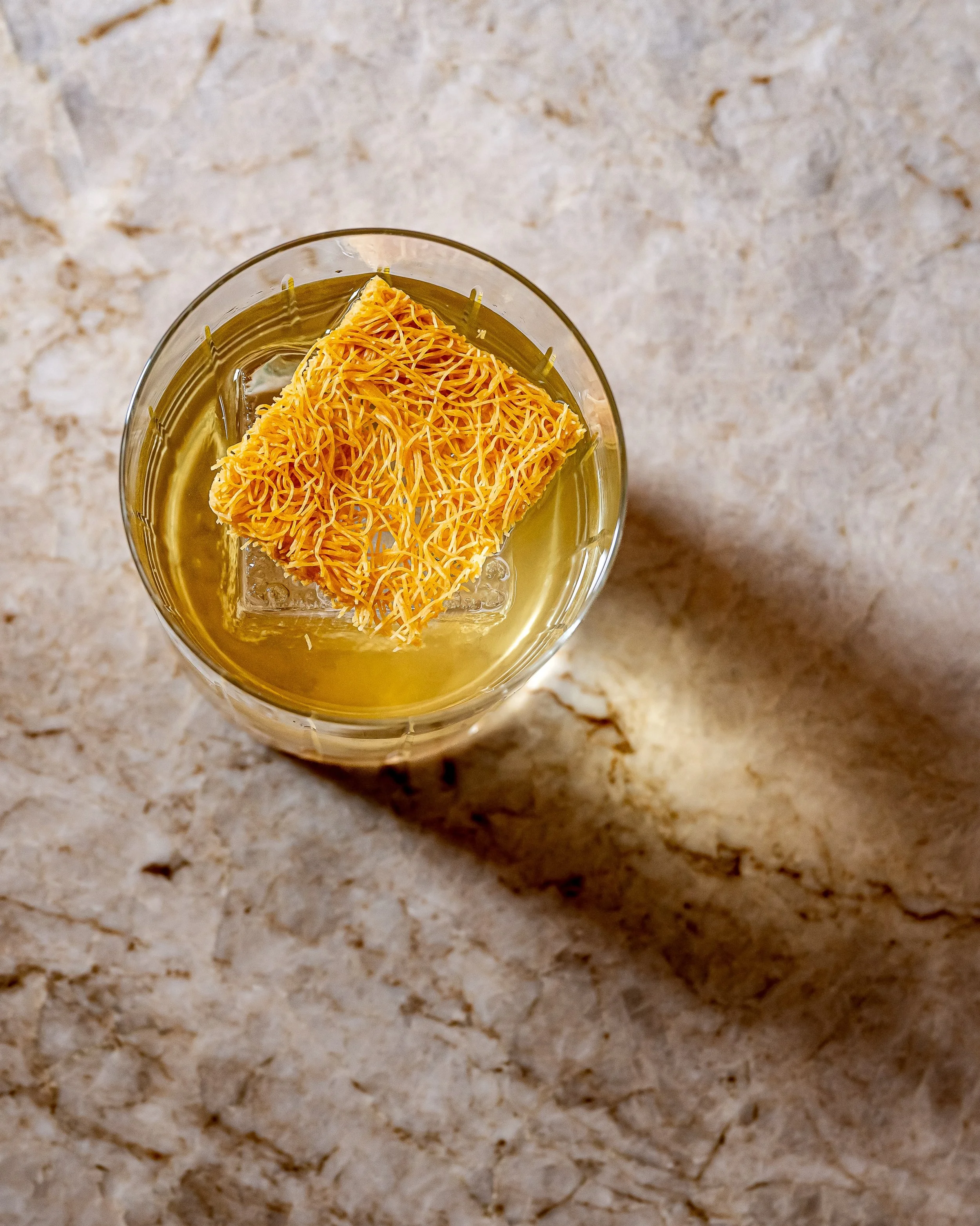 KNAFFE 2.0

Inspired by our staple dessert, a rich and bold feast for the senses. A clarified milk punch that combines drink and culinary, crossing ingredients found in our knaffe dessert.

Brown butter-washed r(h)ums &bull; Pistachio Orgeat &amp; Ar