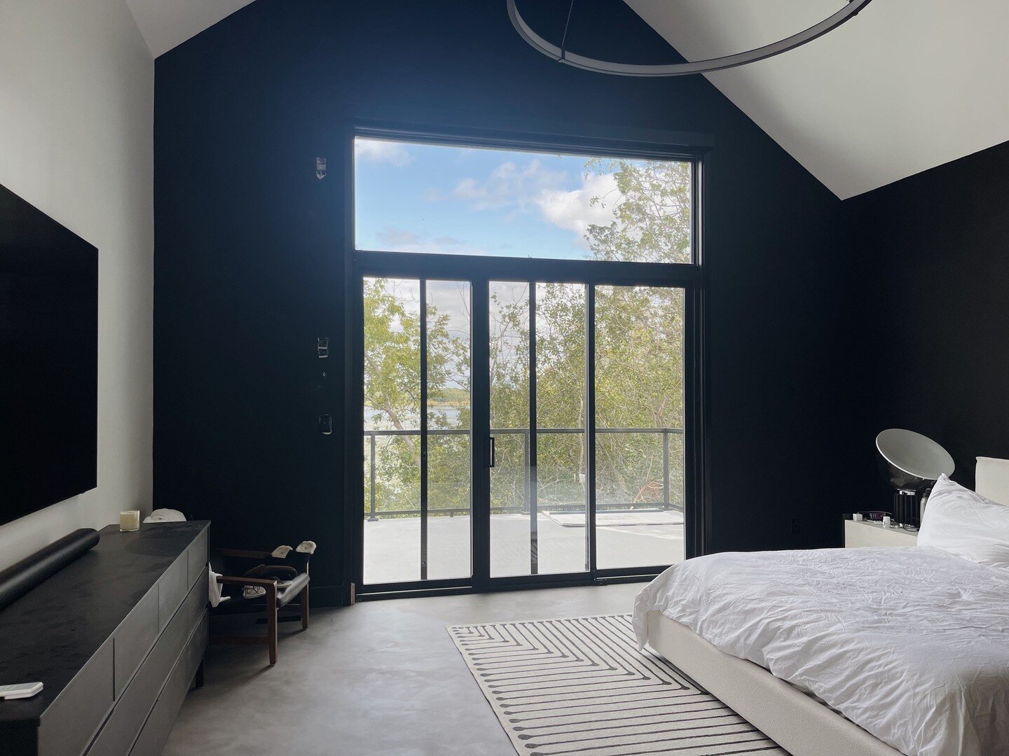 A room with a view. Beautiful doors flank the water facing side of this beautiful new custom home, even the master suite boasts a view of the swans in the morning.⁠
⁠
New Custom Home by @marquiseconstruction⁠
Architectural Design by Maclan Designs