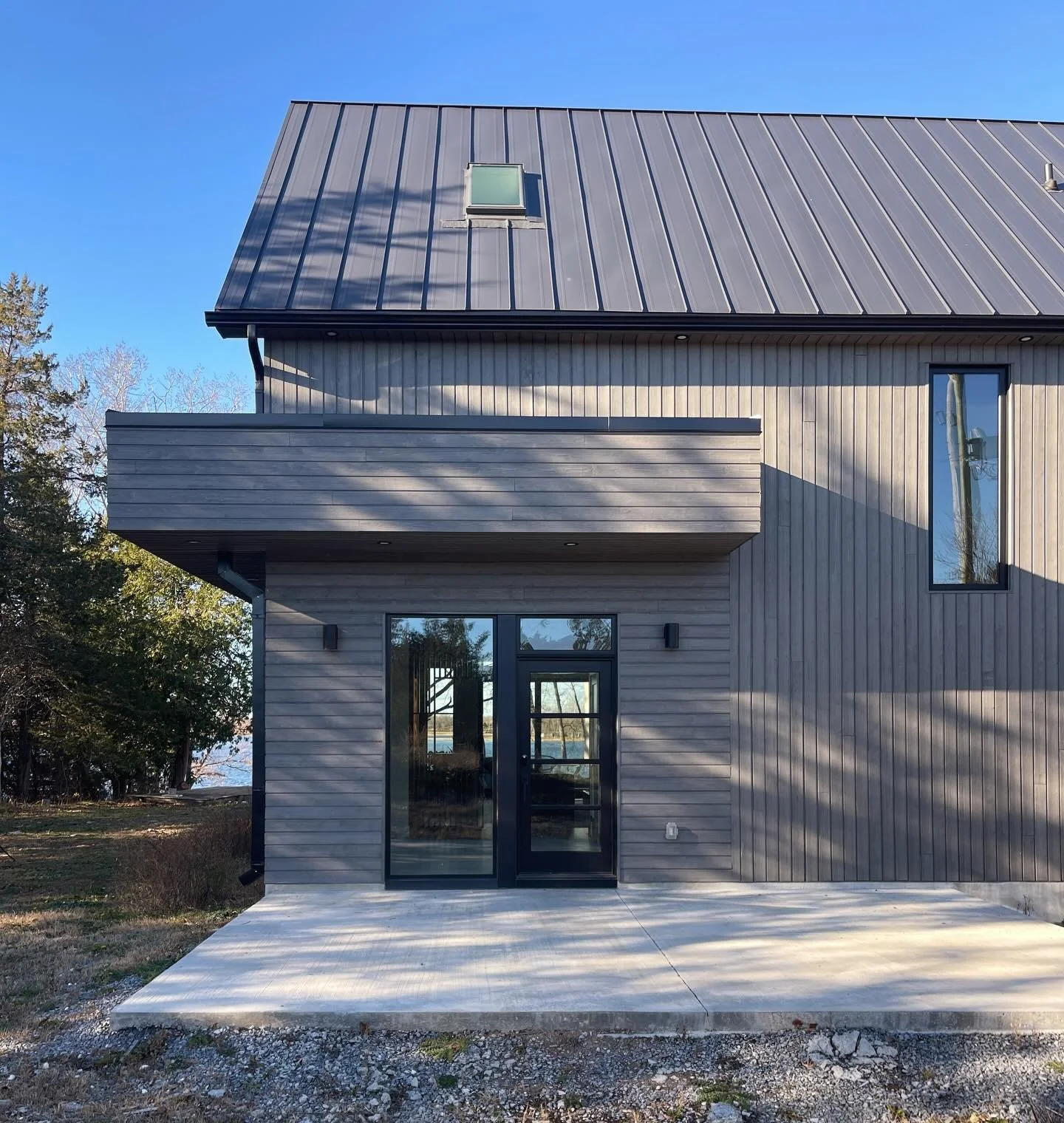 Bold architecture, quiet luxury. A dark and modern retreat made for waterfront living. #marquisebuilt