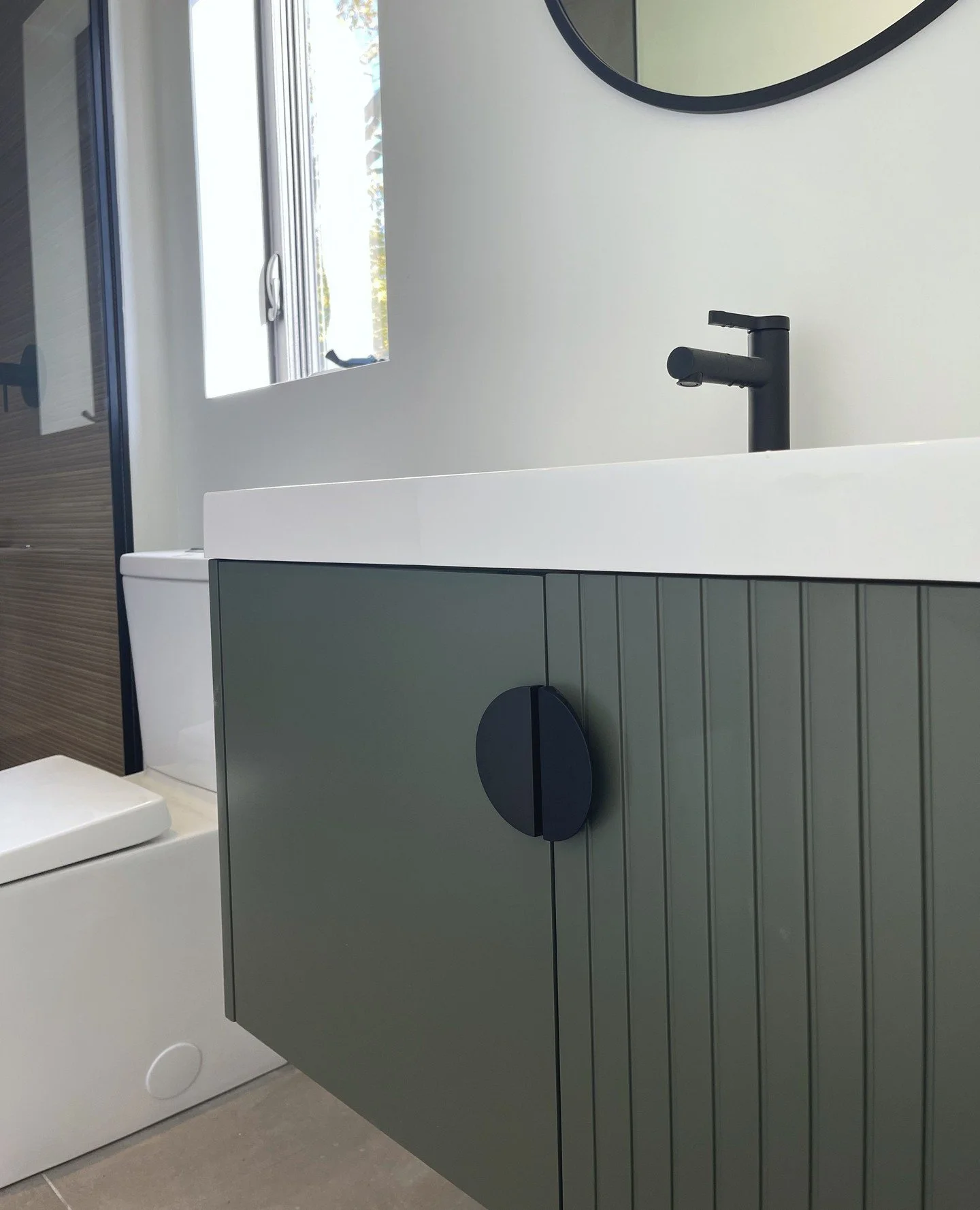 Warm, inviting, and full of character&mdash;this bathroom proves that modern doesn&rsquo;t have to feel cold. This olive green vanity brings a touch of country charm to every morning routine. 🌿 #MarquiseConstruction #ModernCountryLiving #DreamBathro