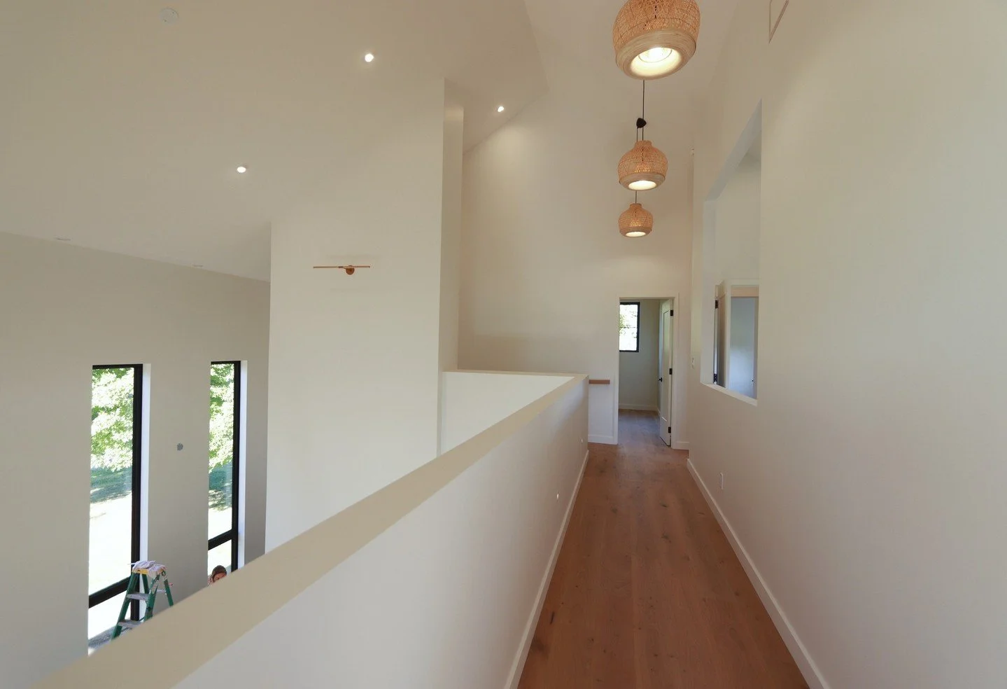 Upstairs, yet connected. The open-concept design lets you look down into the living room, blending spaces for a light, airy, and effortlessly social home. ✨ #MarquiseConstruction #OpenConceptLiving #ModernHomeDesign #CountryHomes