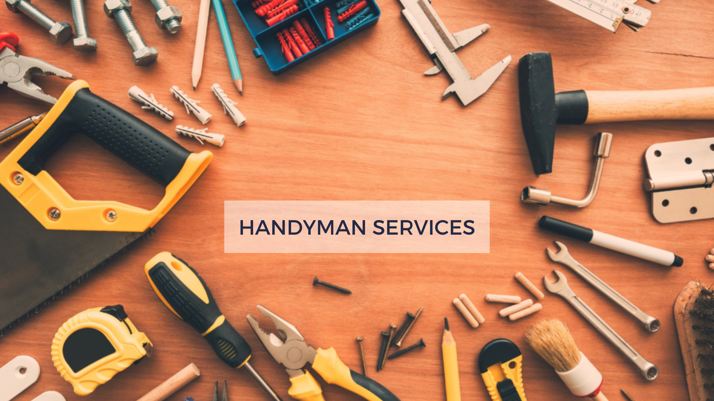 A variety of handyman tools and supplies scattered on a wooden surface, including a cordless drill, screws, wrenches, a hammer, pliers, a caliper, a screwdriver, a measuring tape, pencils, and a small tool organizer, with a label in the center that reads "Handyman Services."