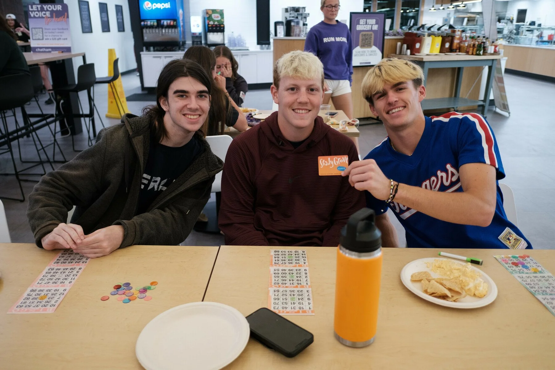 Three Chatham students pose together for a photo during Orientation's Bingo Night