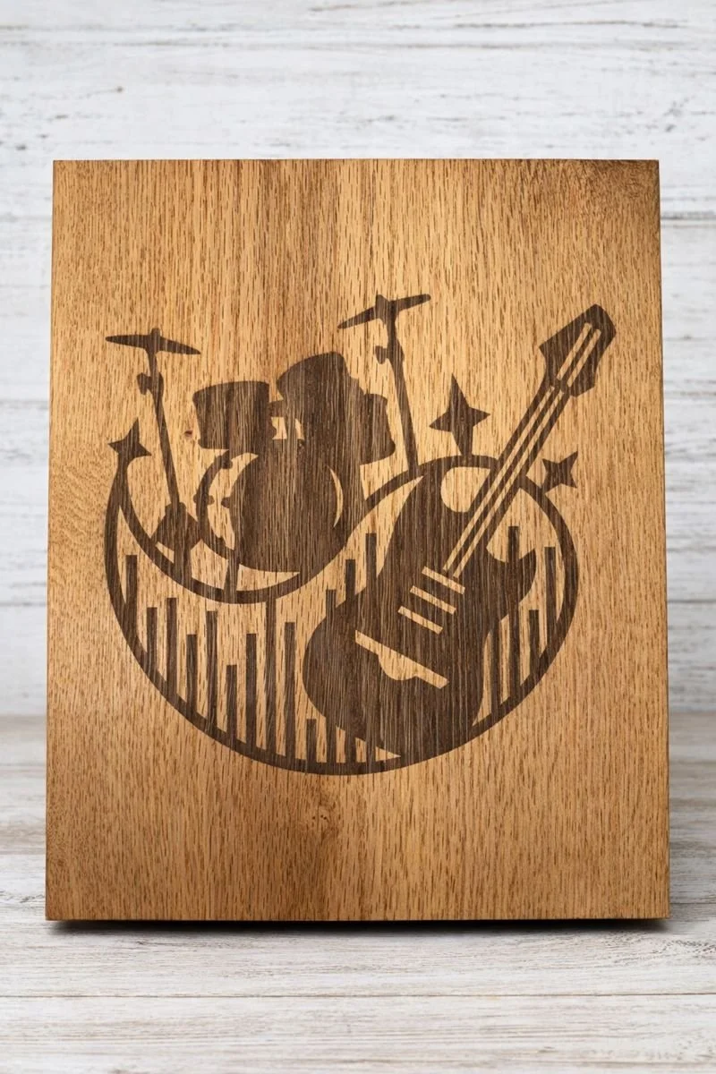 Laser engraved guitar and drum wall art on solid wood, straight-on product view