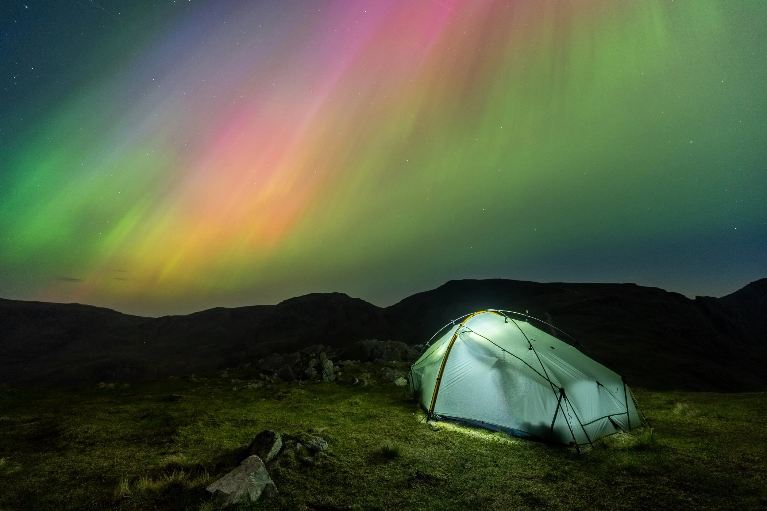Wild camping in the Lake District National Park under the aurora borealis.
