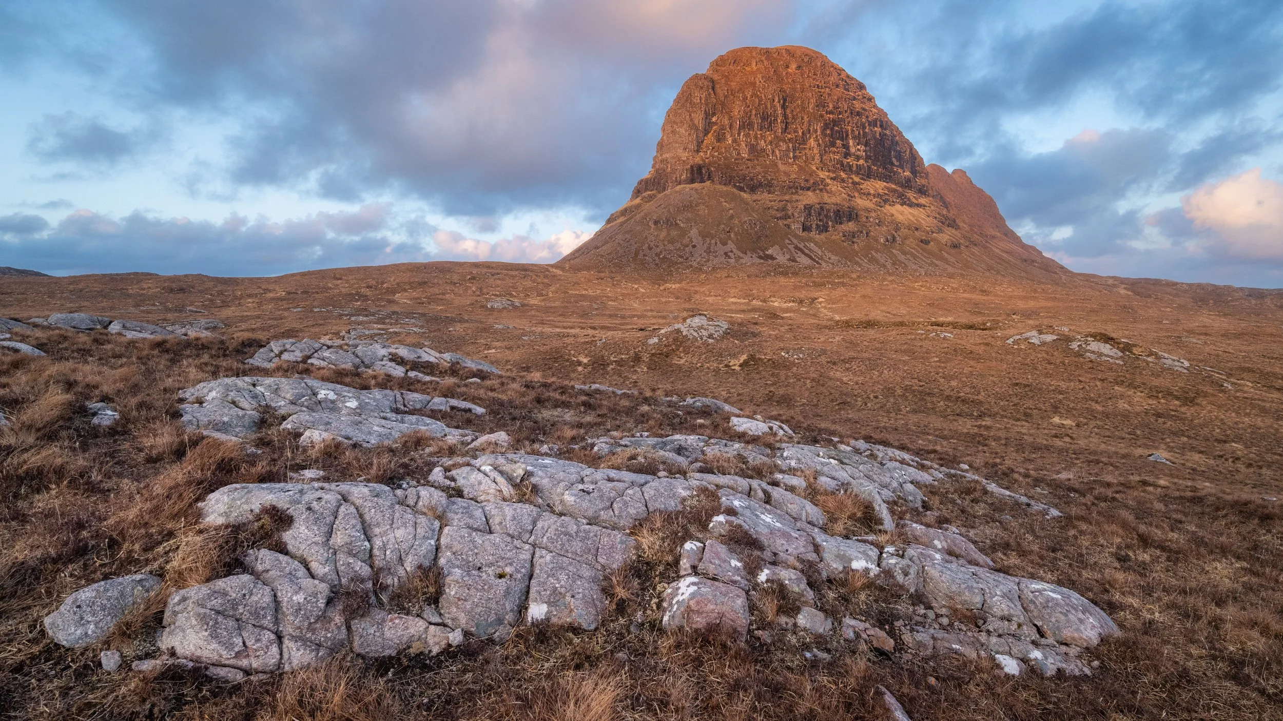 A landscape photograph of Suilven in Assynt, in the Northwest Highlands of Scotland.