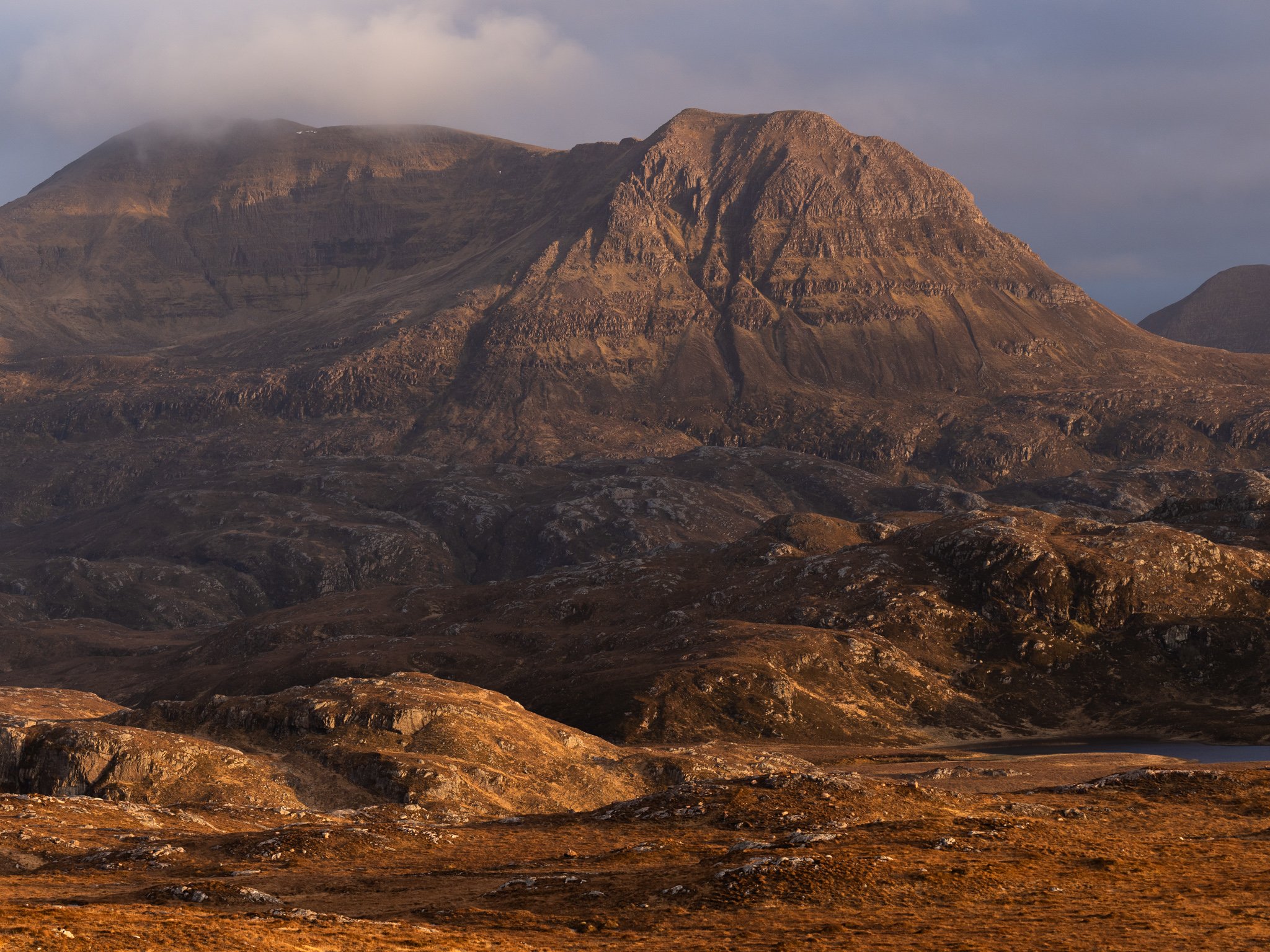 Sunset light on Cul Mòr in Assynt taken from just below Suilven in the northwest Highlands of Scotland.