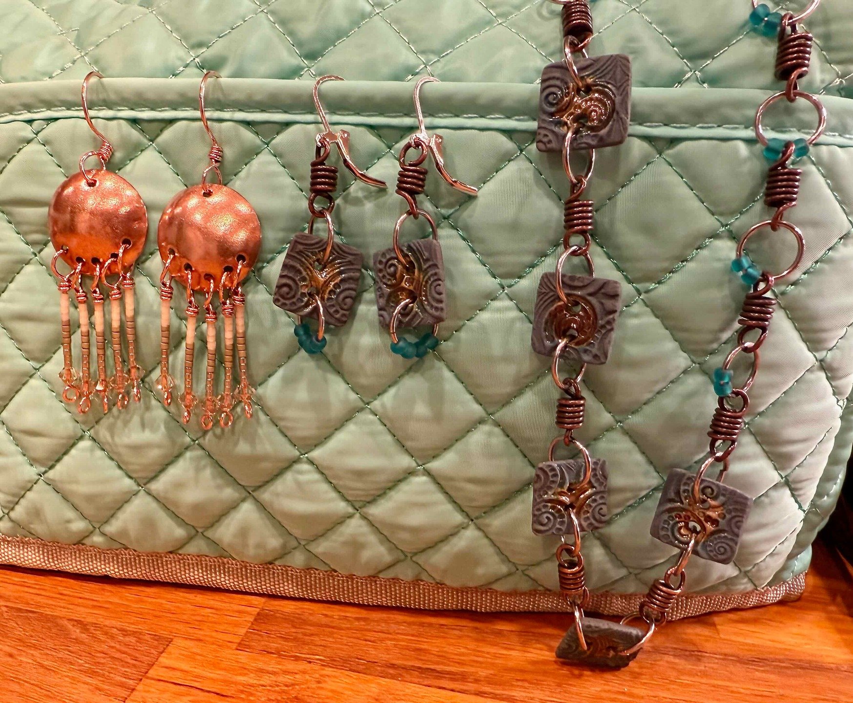 It's been a while since I've made something -- parts of these three projects were actually started many moons ago and I decided today was the day they should get finished. The copper disks were cut and shaped by me. The square beads in the other two 