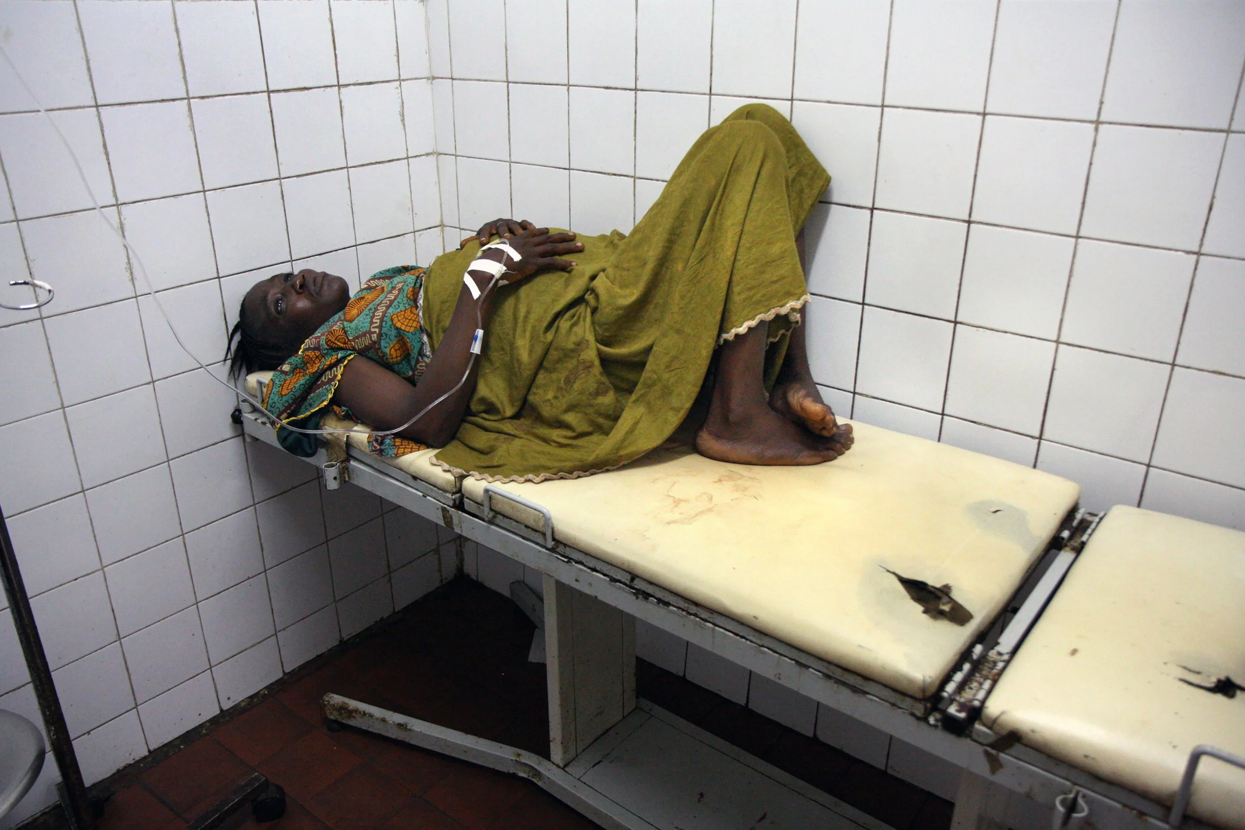 (photo by Carol Guzy/ The Washington Post) Freetown, Sierra Leone, Oct. 6, 2008: Bintu Kamara, 28, waits in the labor ward of Princess Christian Maternity Hospital. She survived an emergency C-section, but her baby did not. Sierra Leone had the highe