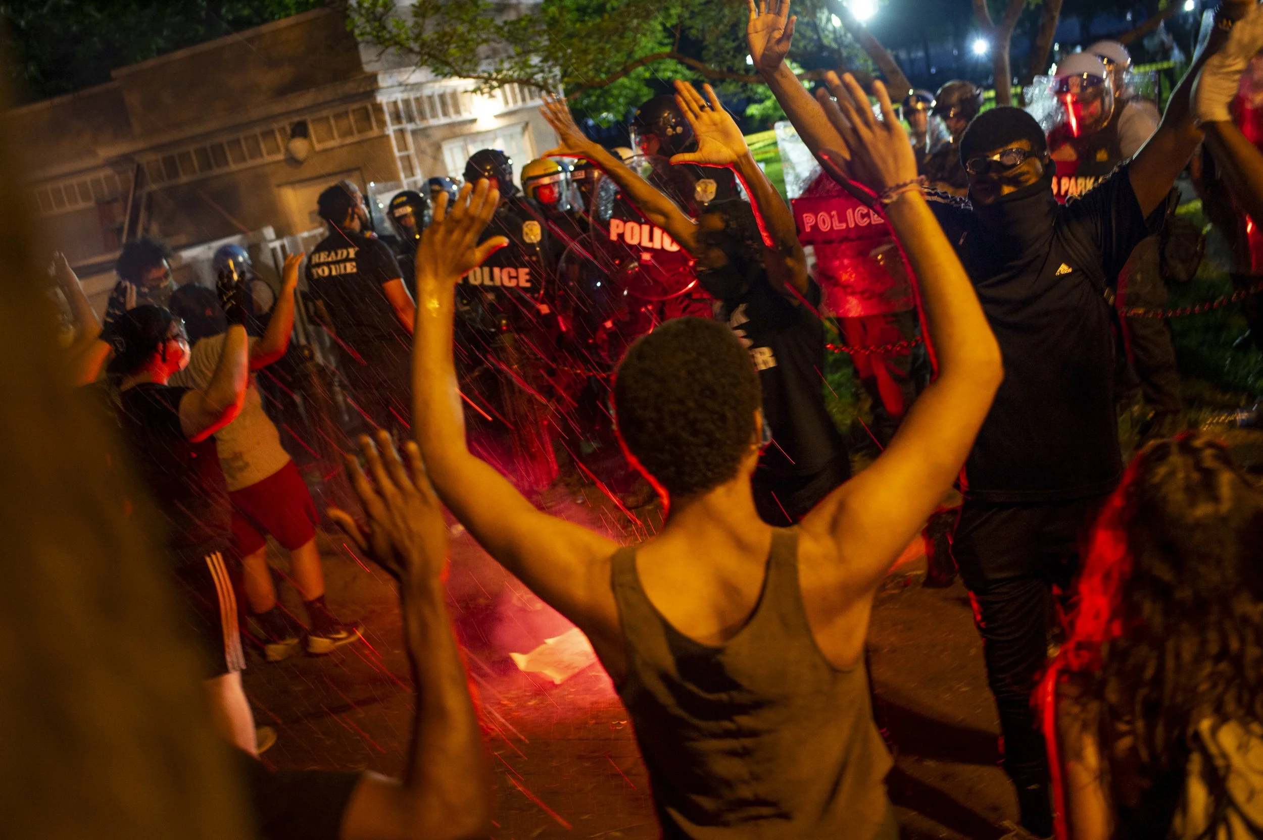 (photo by Bonnie Cash) Washington, D.C., May 30, 2020: Bricks, tear gas and fireworks are exchanged in Lafayette Square during protests over George Floyd's death. Floyd was murdered by the police during an arrest on May 25.