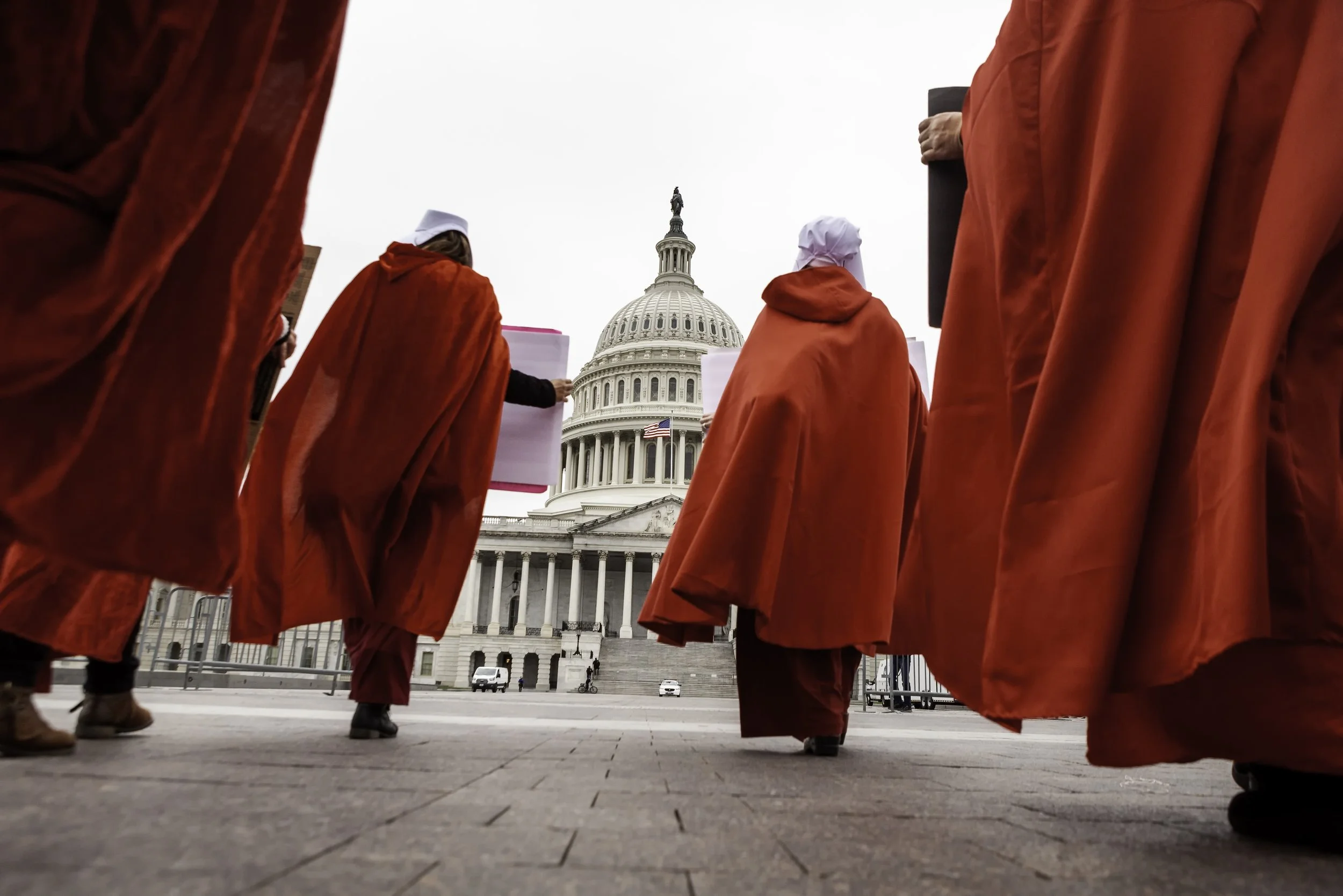 (photo by Allison Bailey/NurPhoto) Washington, D.C., May 8, 2022: Members of Handmaids Army DC march to the U.S. Capitol, protesting the Supreme Court's leaked preliminary decision to overturn Roe v. Wade – which ended the federal right to abortion a