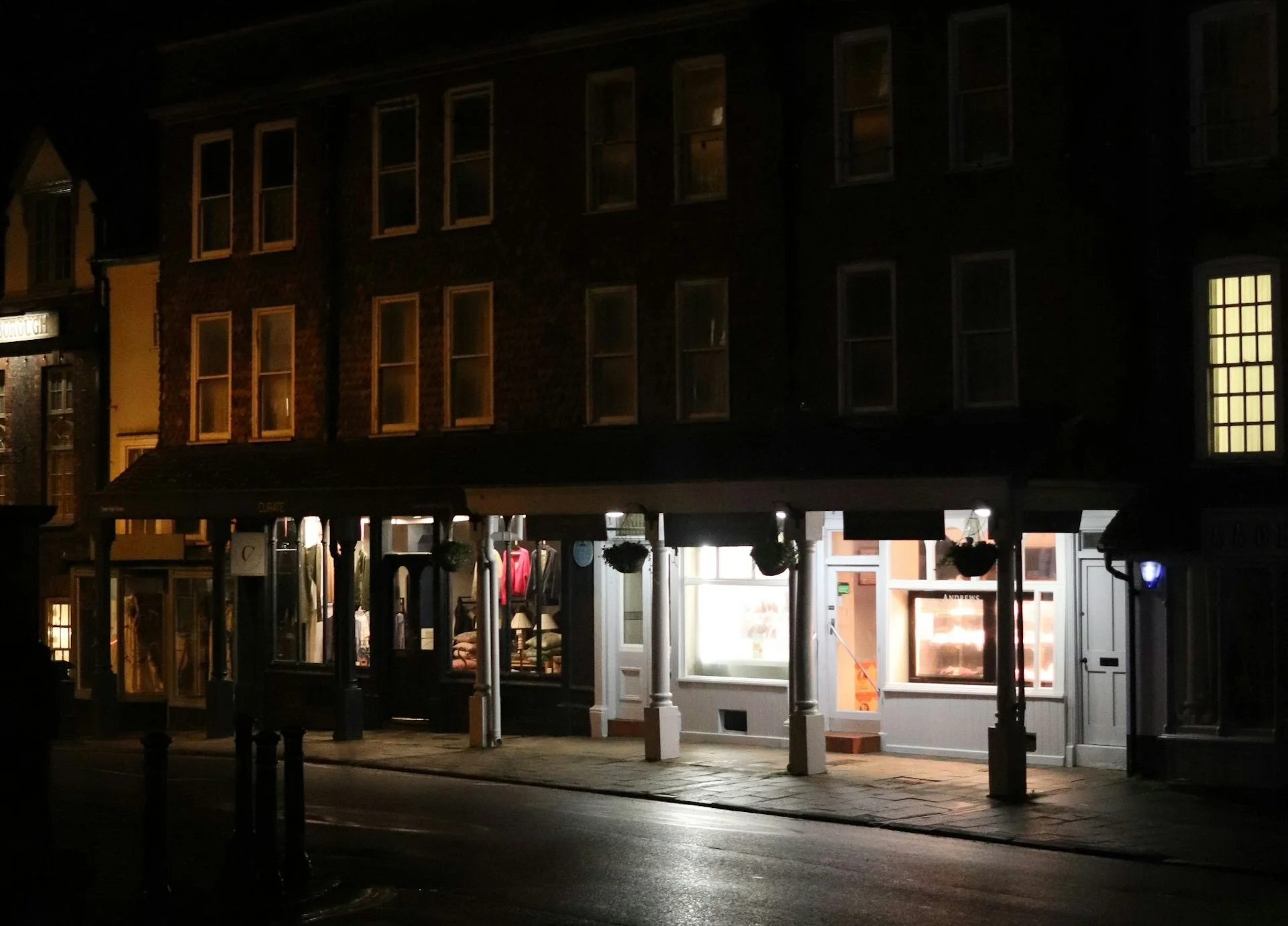 Empty street with shops at night — local business visibility, mariano alvarez, shift in life consulting