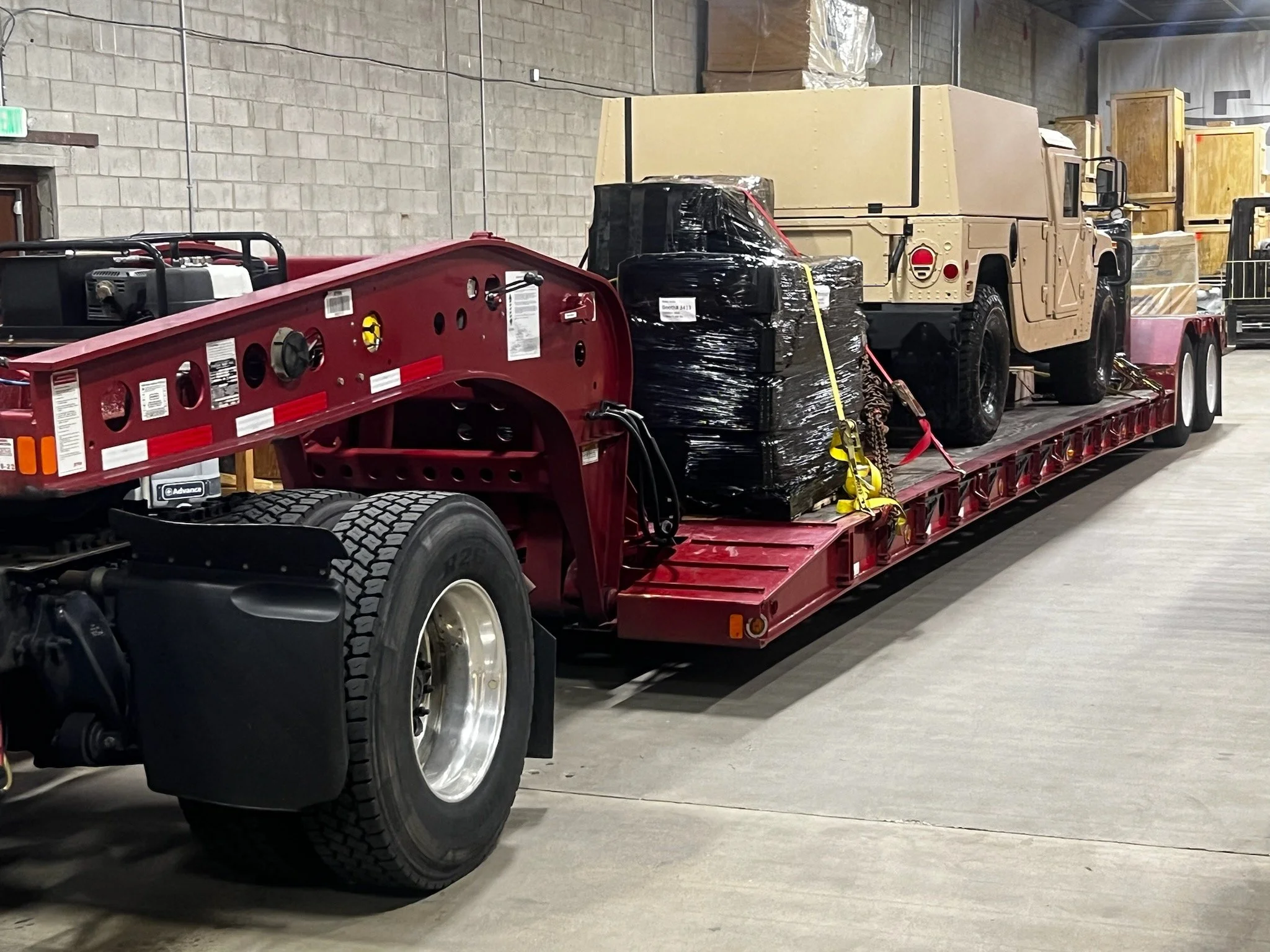 military jeep on truck.jpeg