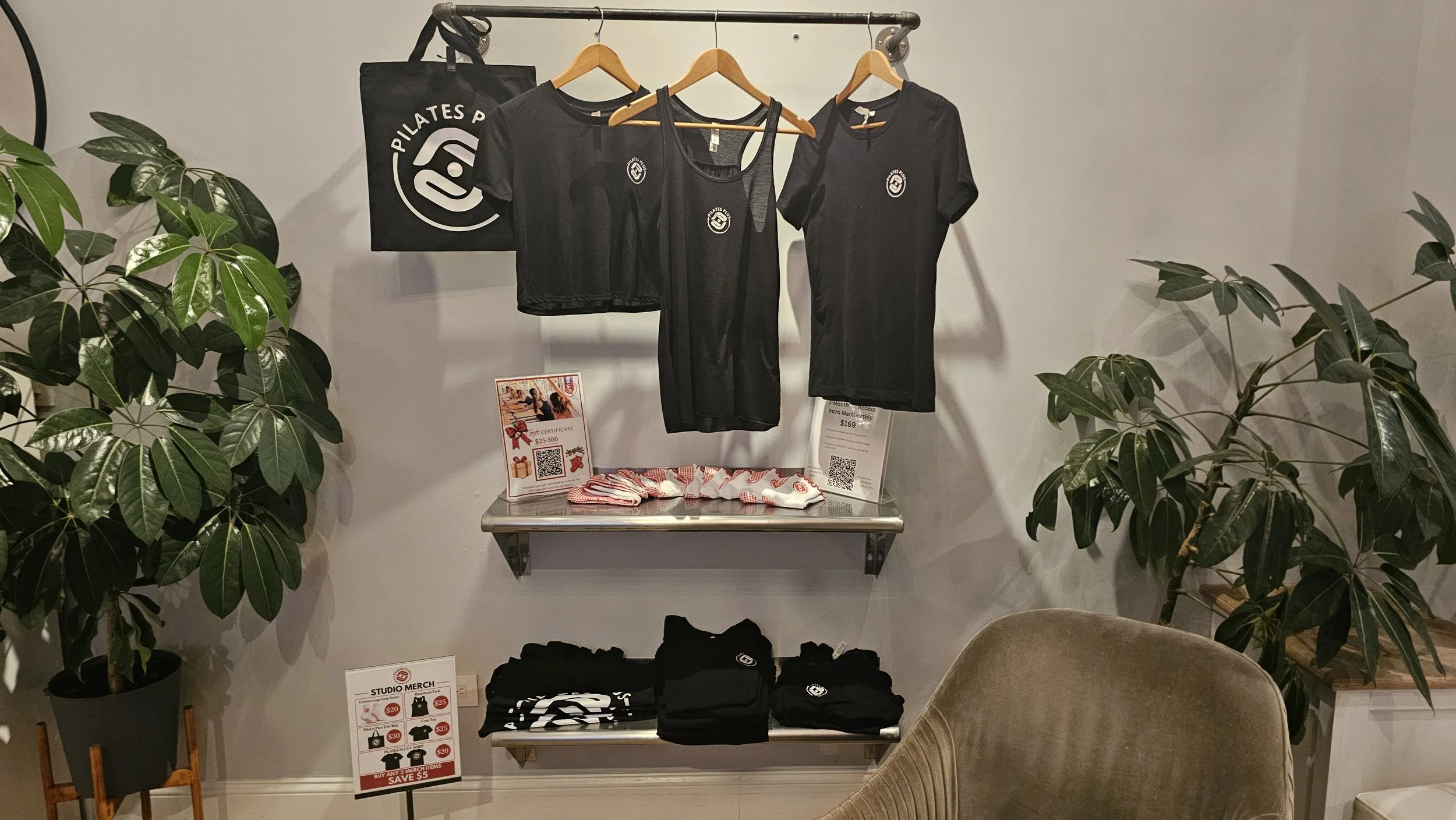 Pilates Plus shirts, tote bag and grip socks in the studio shop