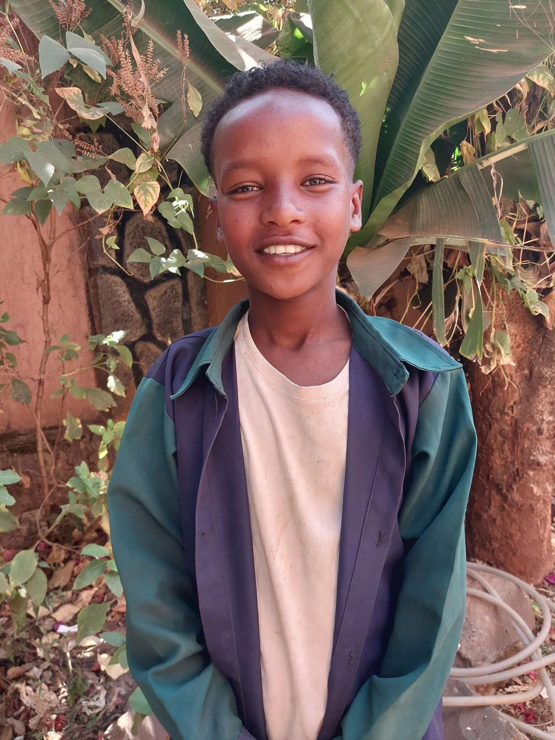 Tariku | Age 13 | Grade 4 | Tariku loves playing soccer and hanging out this his friends! When he grows up he wants to be a teacher. 