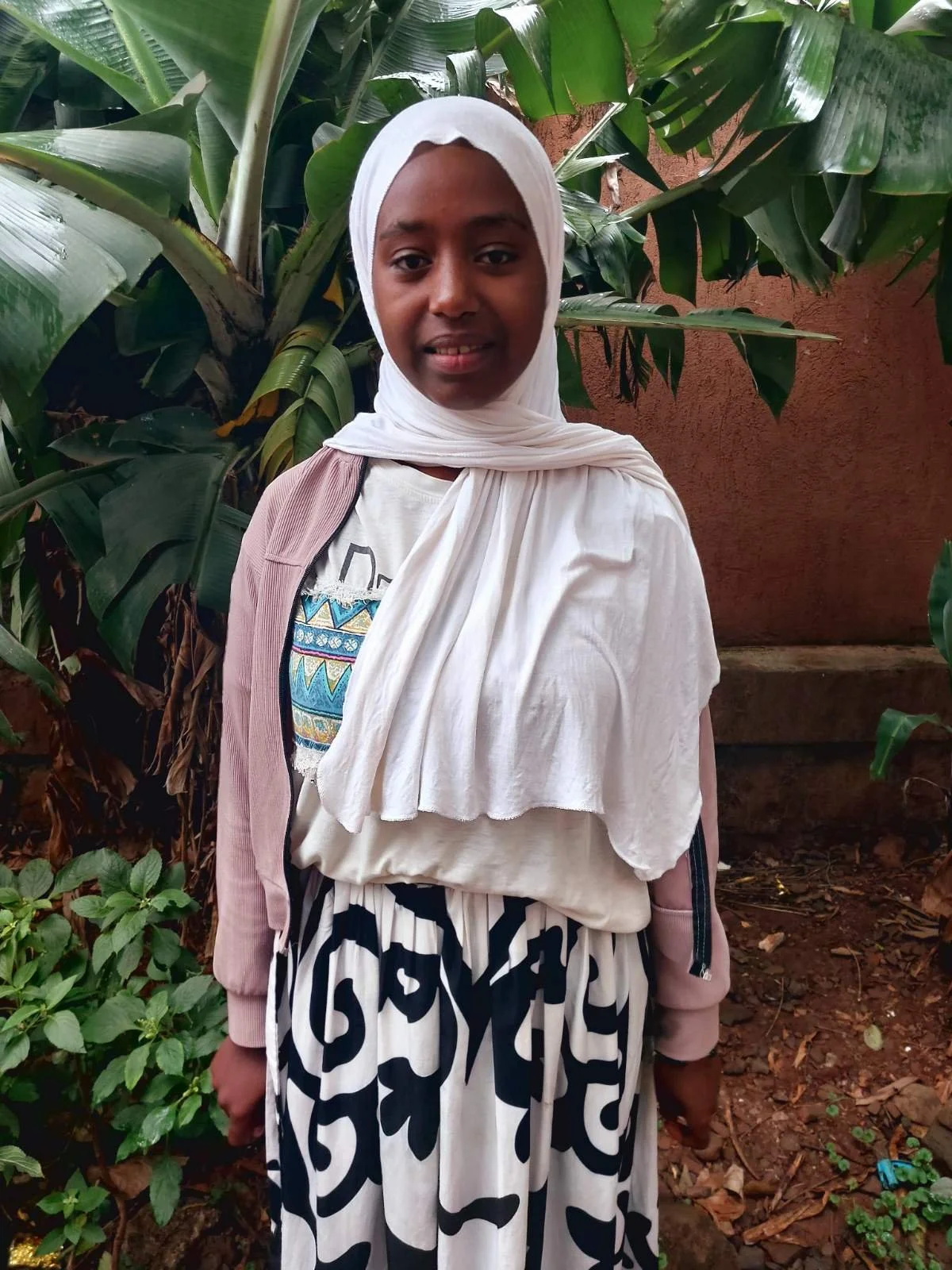 Kidija | Age 18 | Birthday 02/28/2007 | Her father passed away, her mother makes baskets for a living. She has one sister & three brothers.