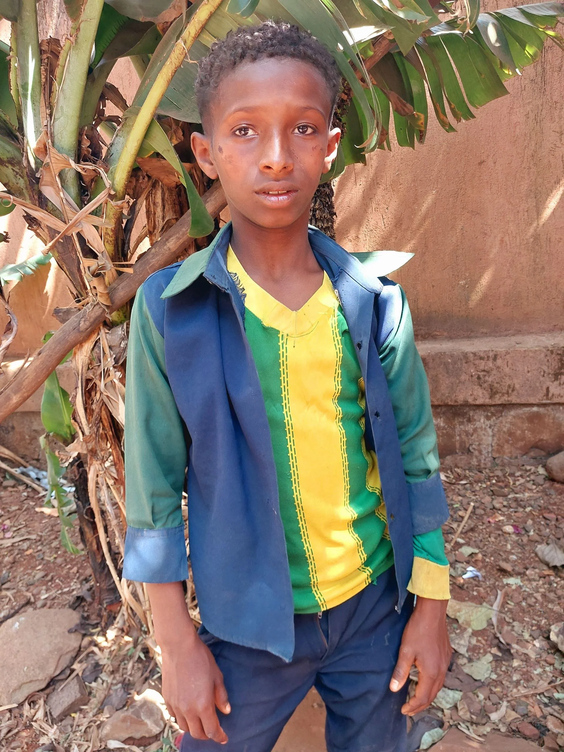 Mohamed | 14yrs old | 4th grade | Mohamed enjoys playing soccer and helping his mother. His favorite food is pasta and favorite subject is math. 