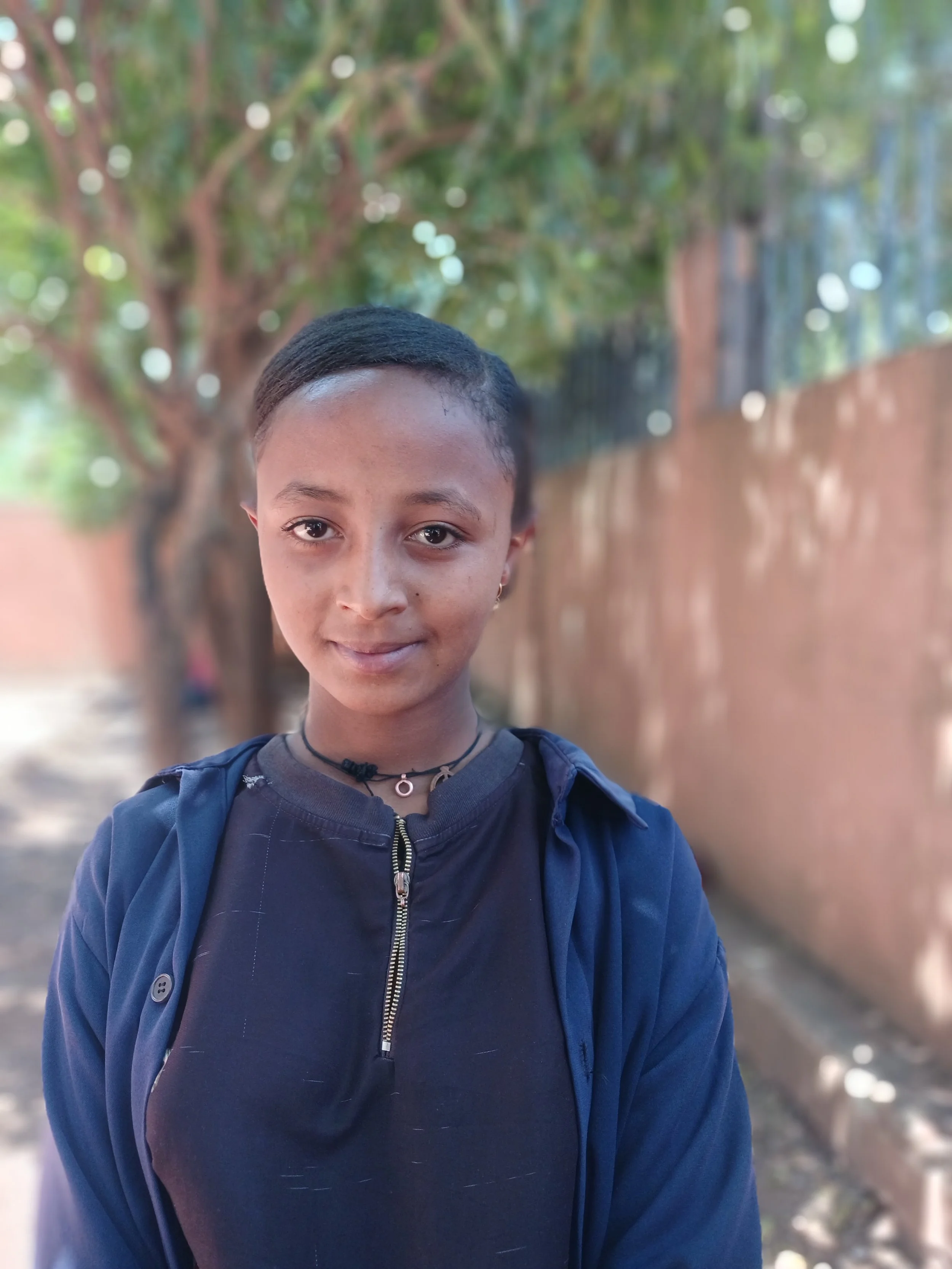 Betelhem | Age 13 | She lives with her mother and would like to be a doctor when she grows up. 
