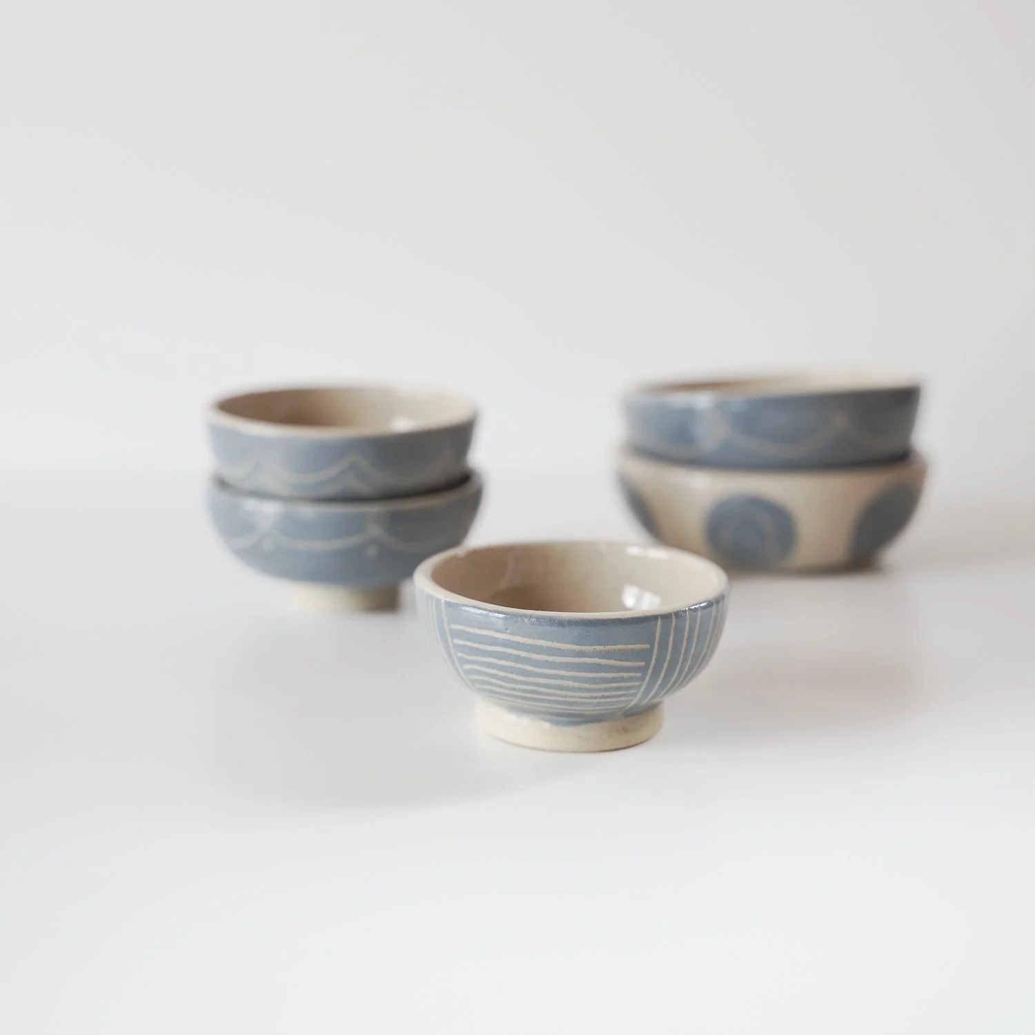 all tiny blue bowls carved.jpg