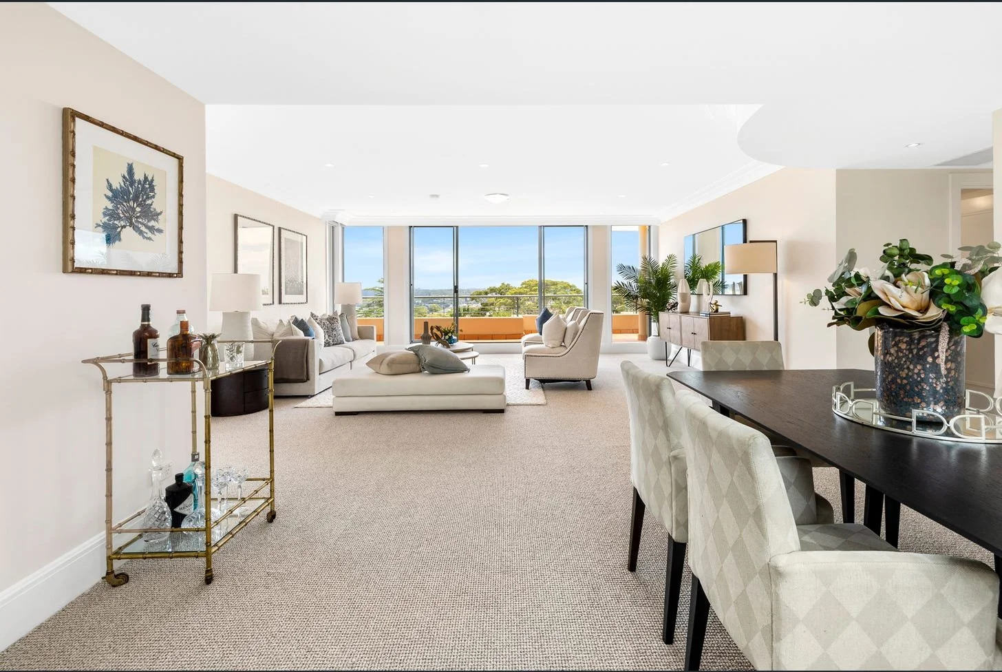 Expansive Mosman penthouse living area with large windows offering natural light and views