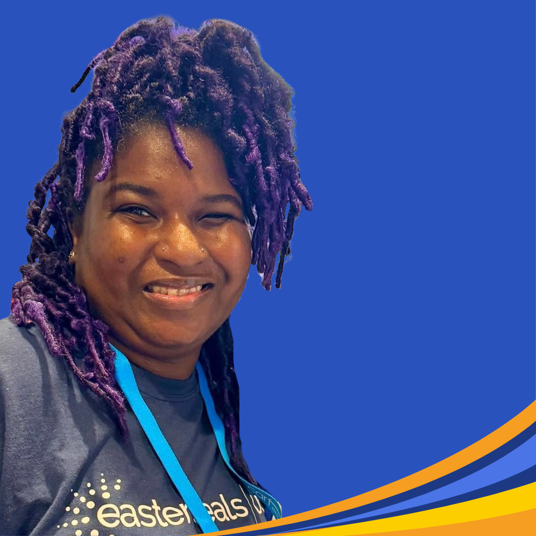 smiling woman with brown and purple hair locks 