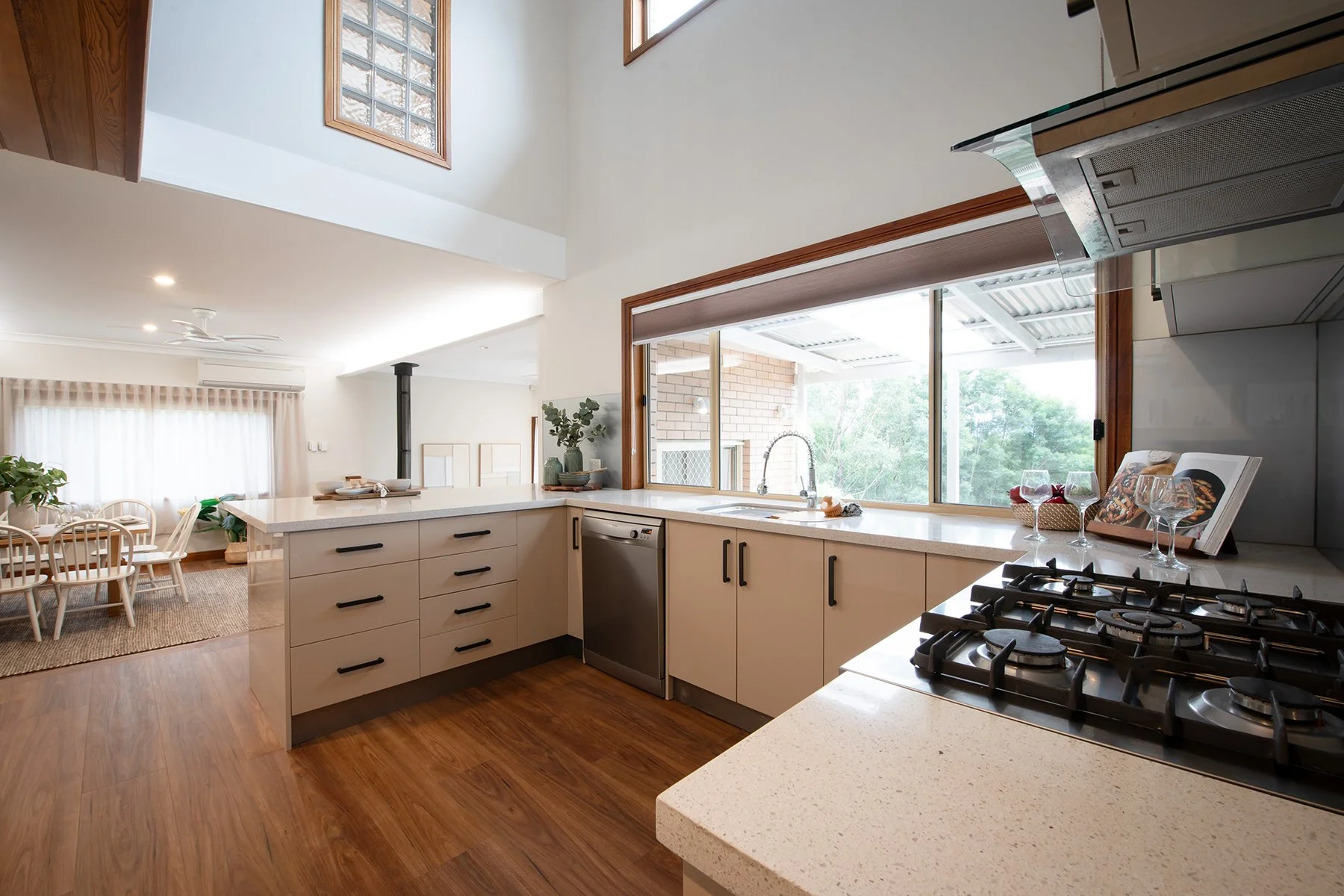 Updated Nowra Hill kitchen featuring warm Taubmans tones and Spotted Gum flooring