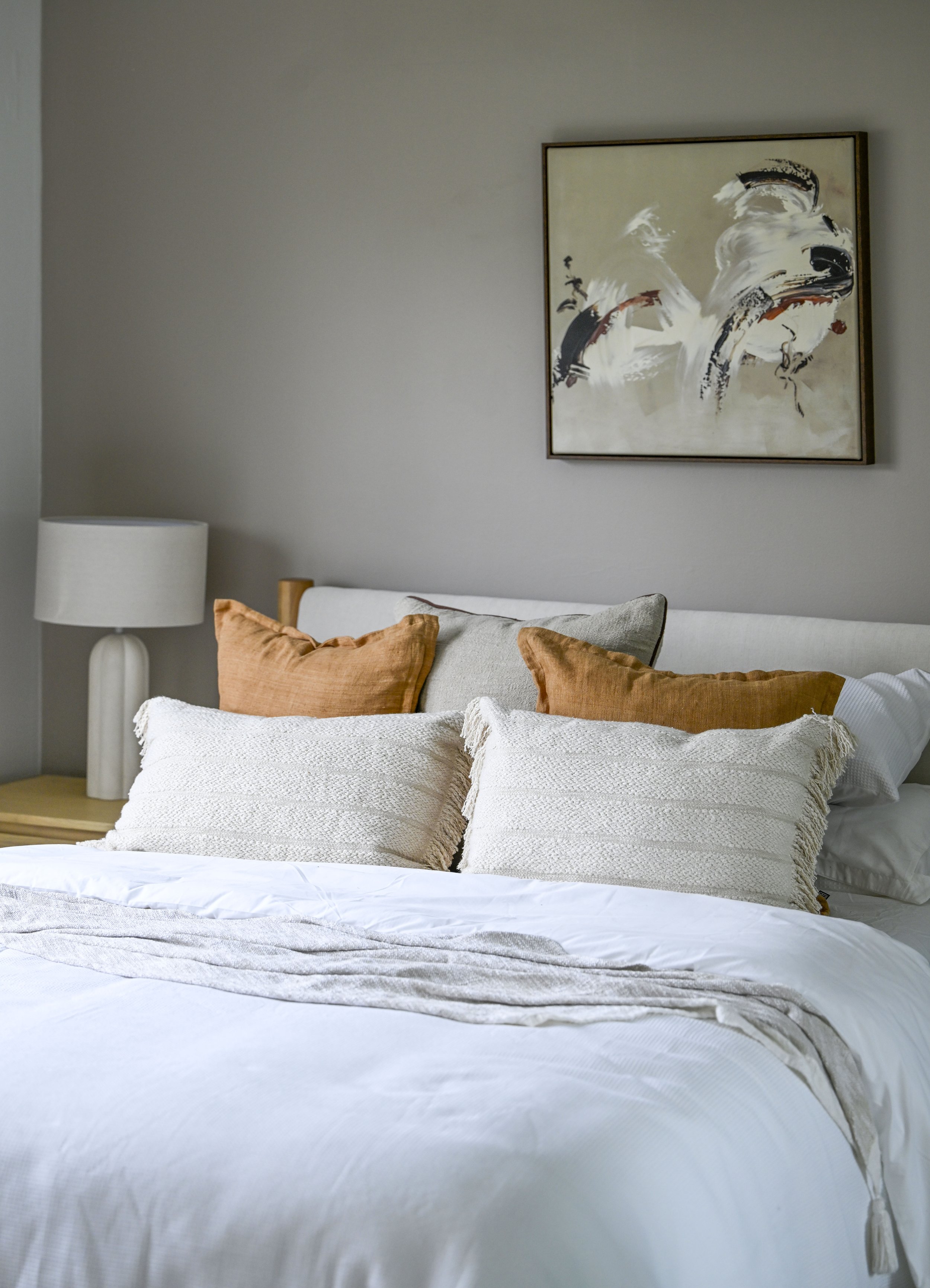 Calm primary bedroom with Azolla Corin carpet, simple bedframe and layered linens (Copy)