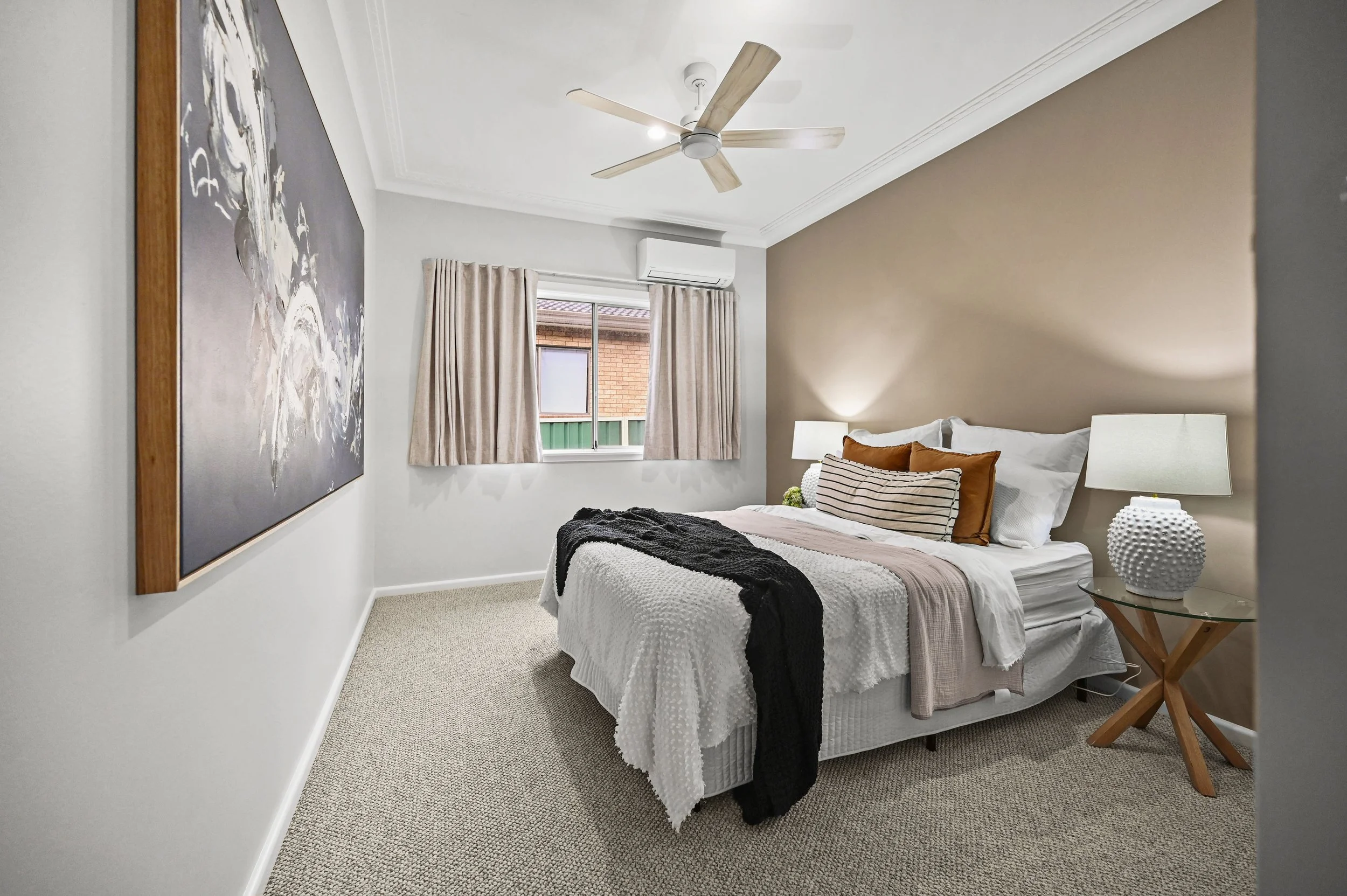 Abother soothing bedroom renovation with a warming colour palette and layered linens and curtains. (Copy)