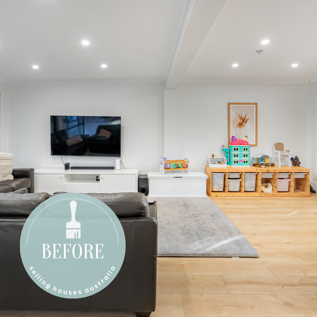 Cluttered living space with mismatched furniture and unfinished joins