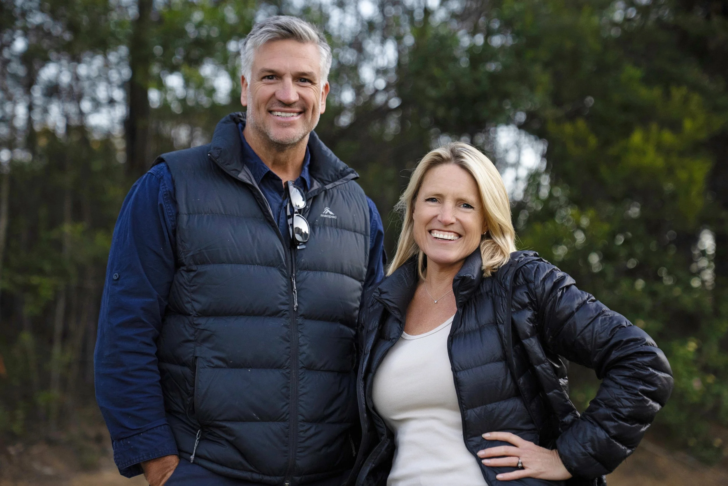 Dennis Scott and Wendy Moore pose for the camera in cosy winter jackets.