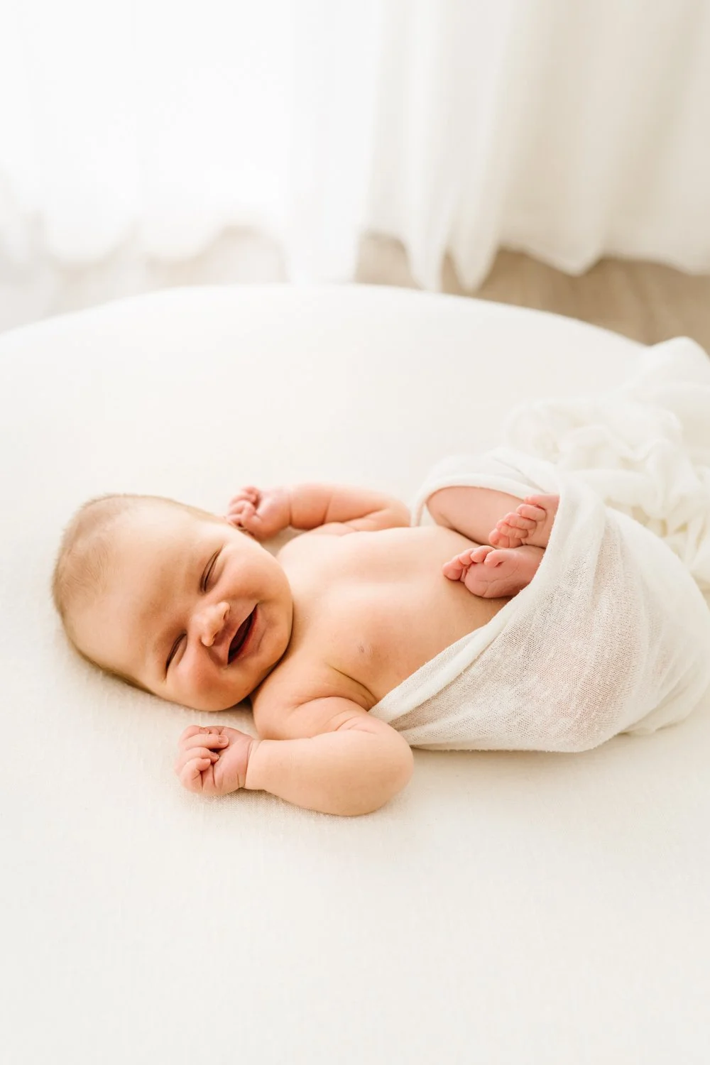 Newborn babies smiles while sleeping