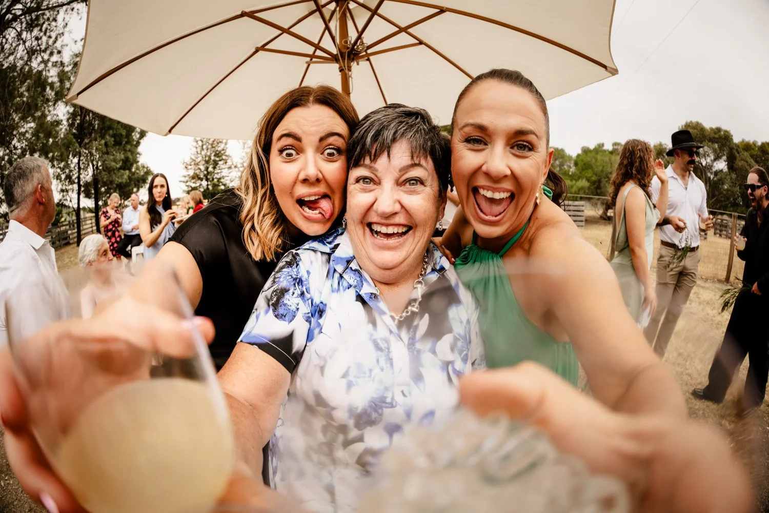 wedding guests make silly faces at the camera