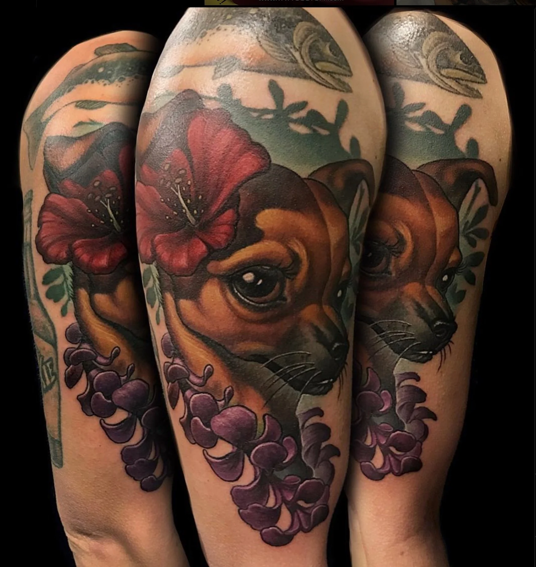 Tattoo of a dog's face with a red flower on its head and purple flowers around its neck, on a person's arm.