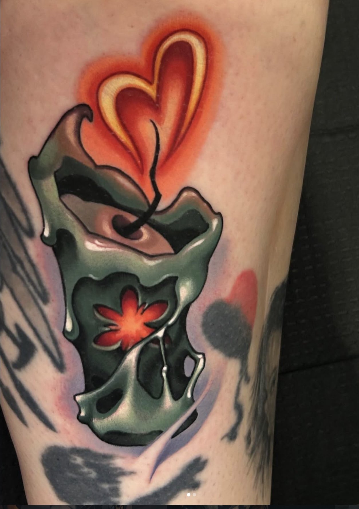 Candle with a heart shape flame.