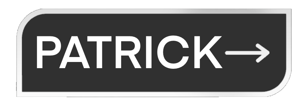 Black and white sign with the name "Patrick" and an arrow pointing to the right.