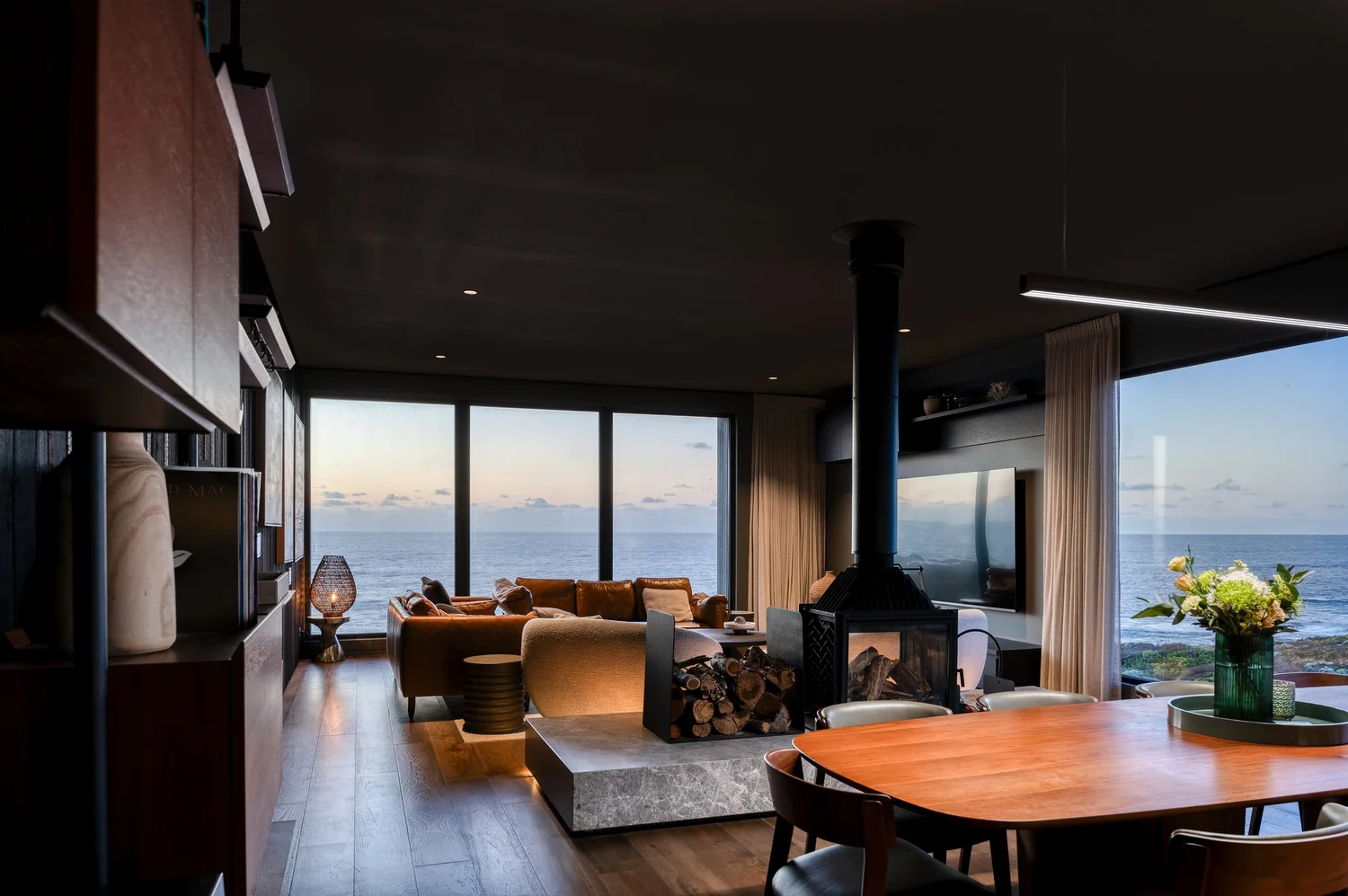 Open-plan lodge interior overlooking the ocean
