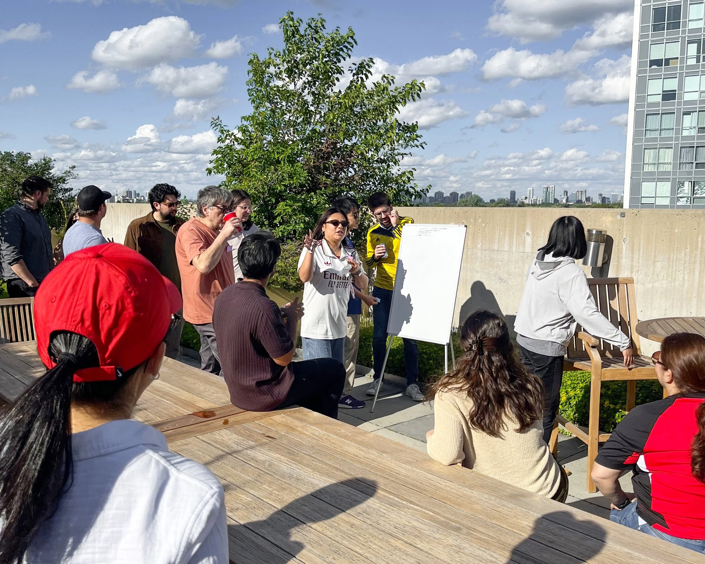 Some things you don&rsquo;t expect to see at work: your principals, mid-charades, giving it absolutely everything.

We welcomed summer on the terrace in a World Cup-themed way, with a potluck from across the team, jerseys, and games that brought out 