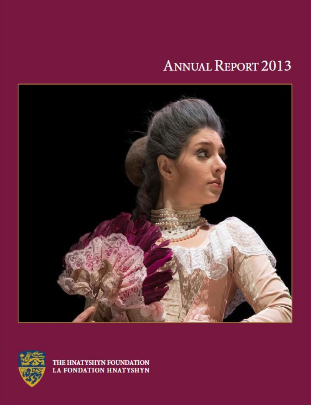 Cover of the 2013 Hnatyshyn Foundation annual report with a woman dressed in historical attire holding a decorative fan.