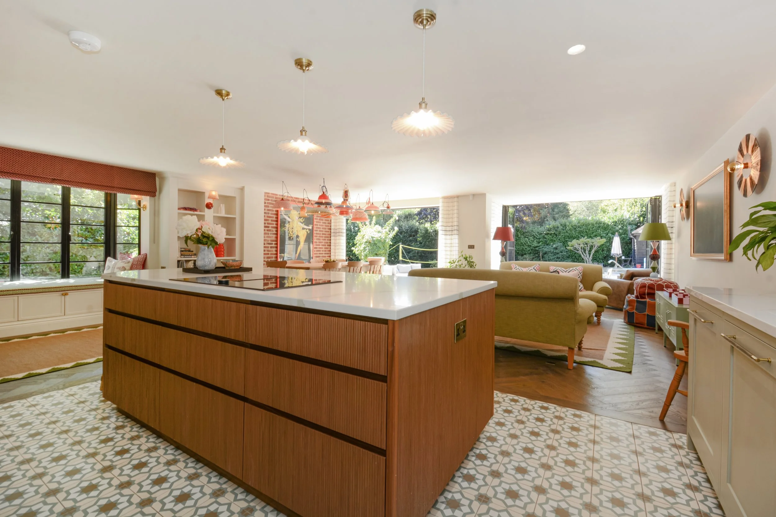 Walnut for the kitchen island feels more like a piece of furniture so sits comfortably near the seating area