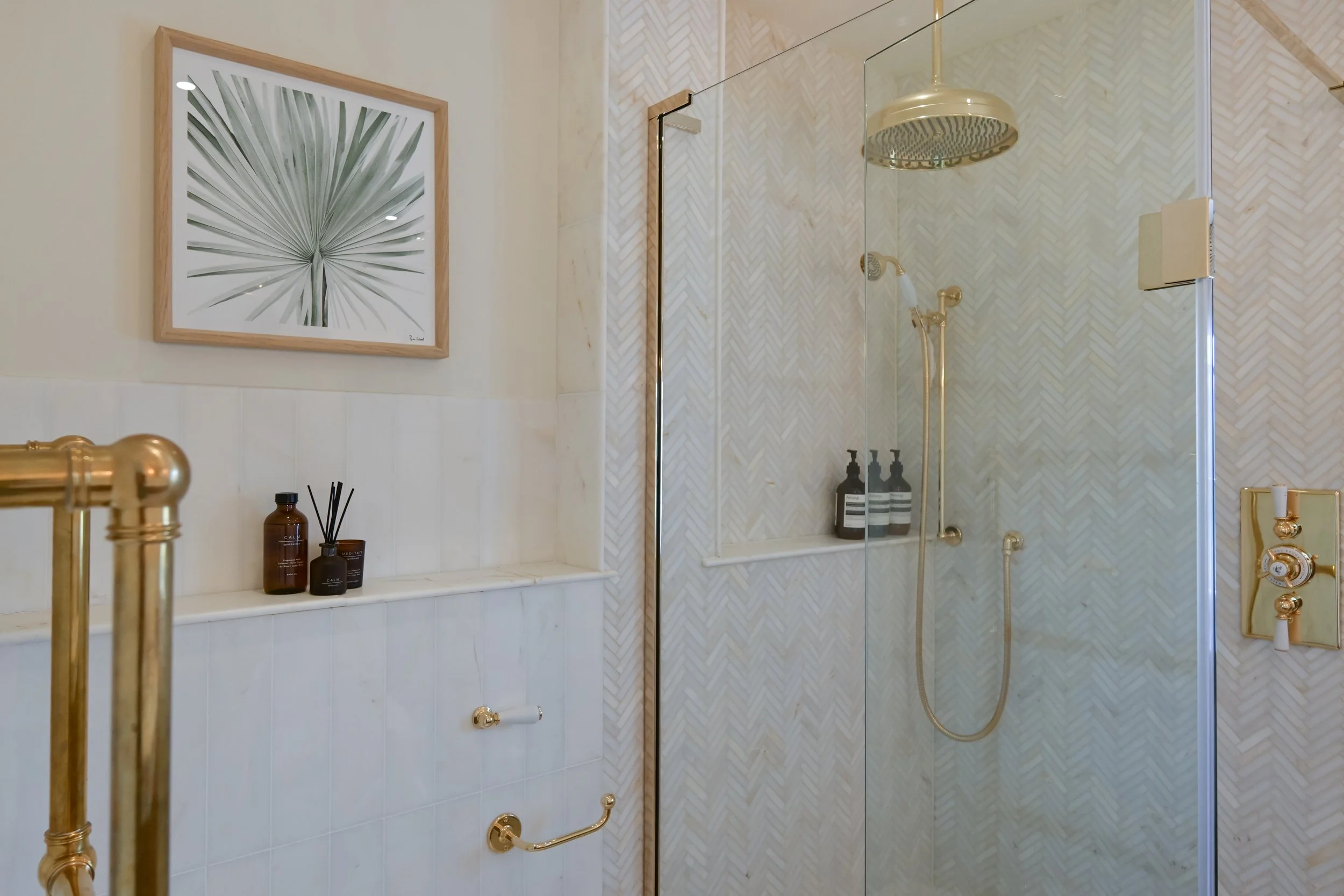 Matching marble is a different tile shape stops the herringbone from overpowering the space