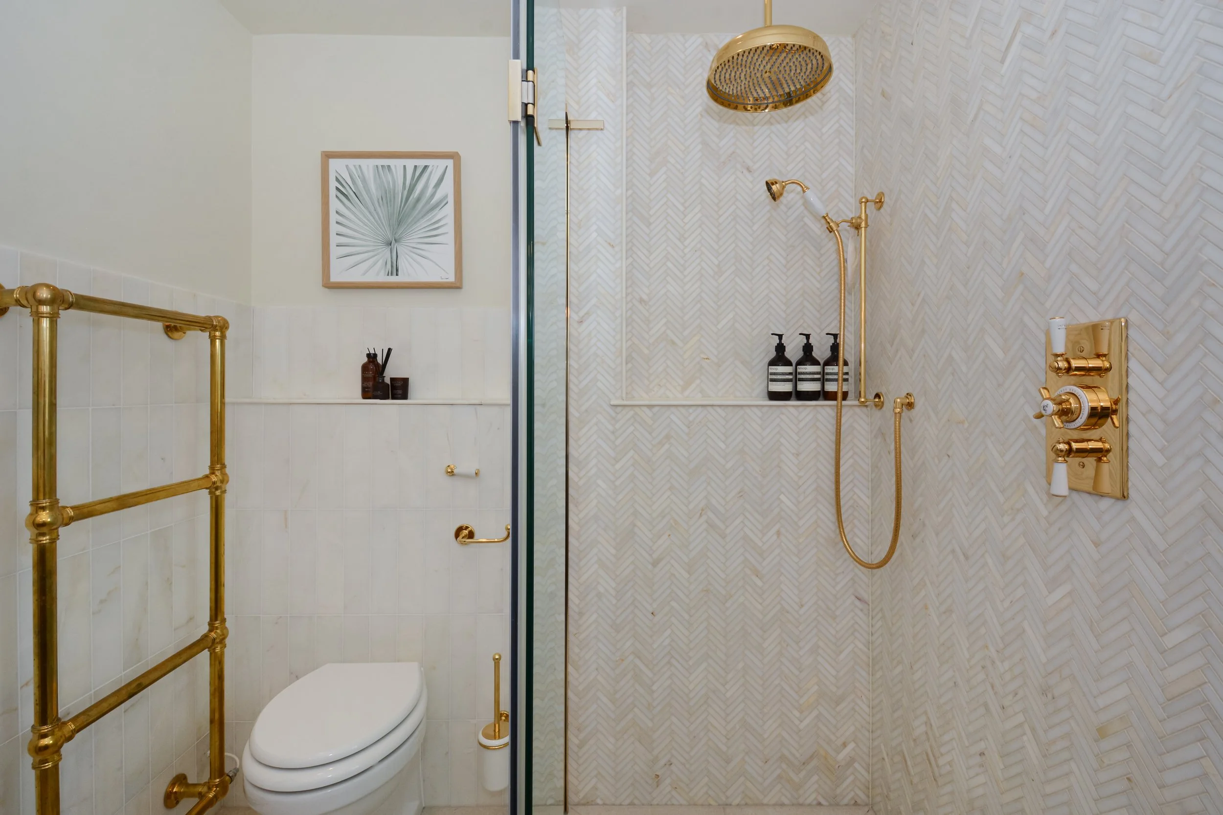 Shower shelf and toilet shelf are bullnosed so no need for tile trim