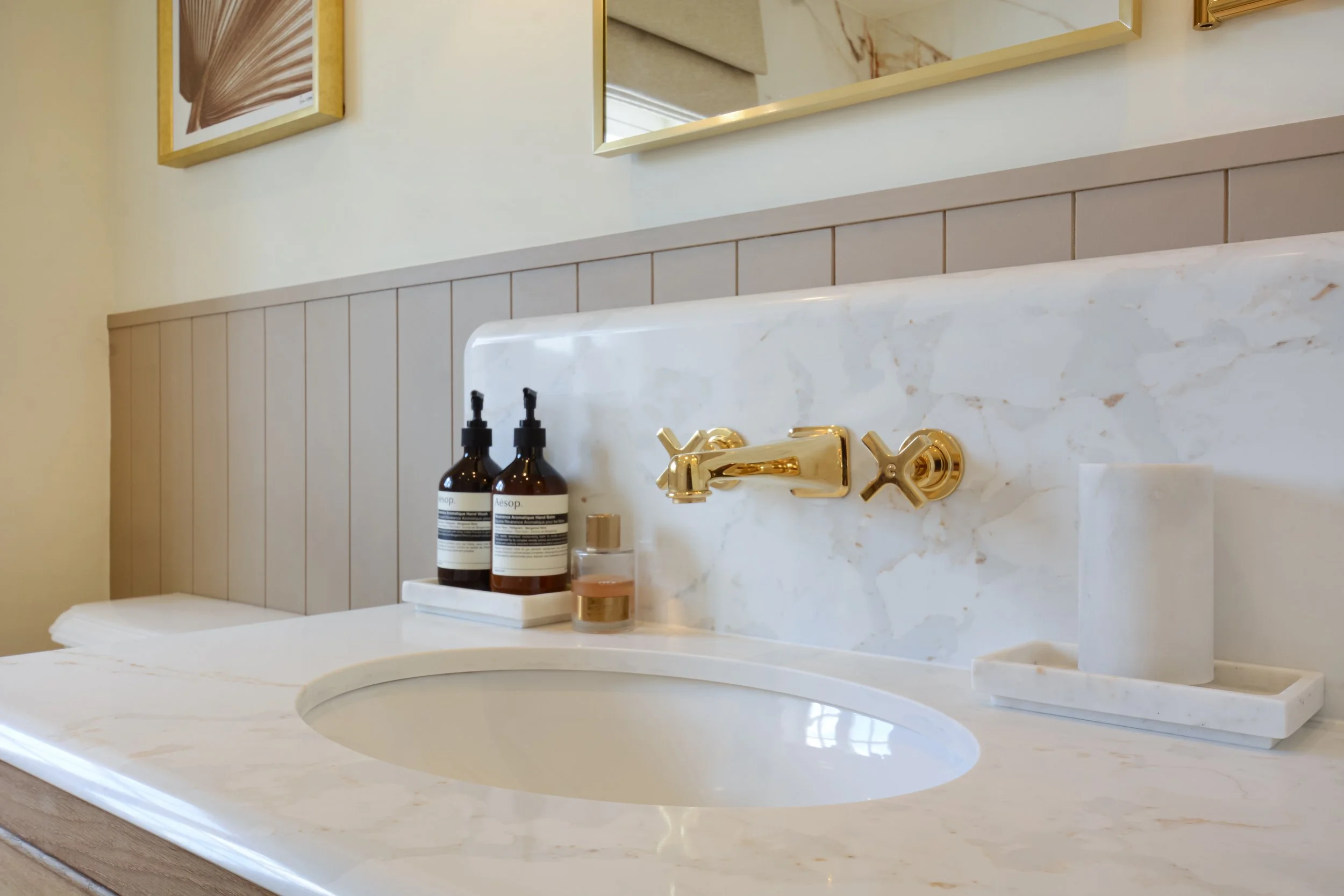 Wall mounted taps in the free standing vanity maximise space and feel uncluttered